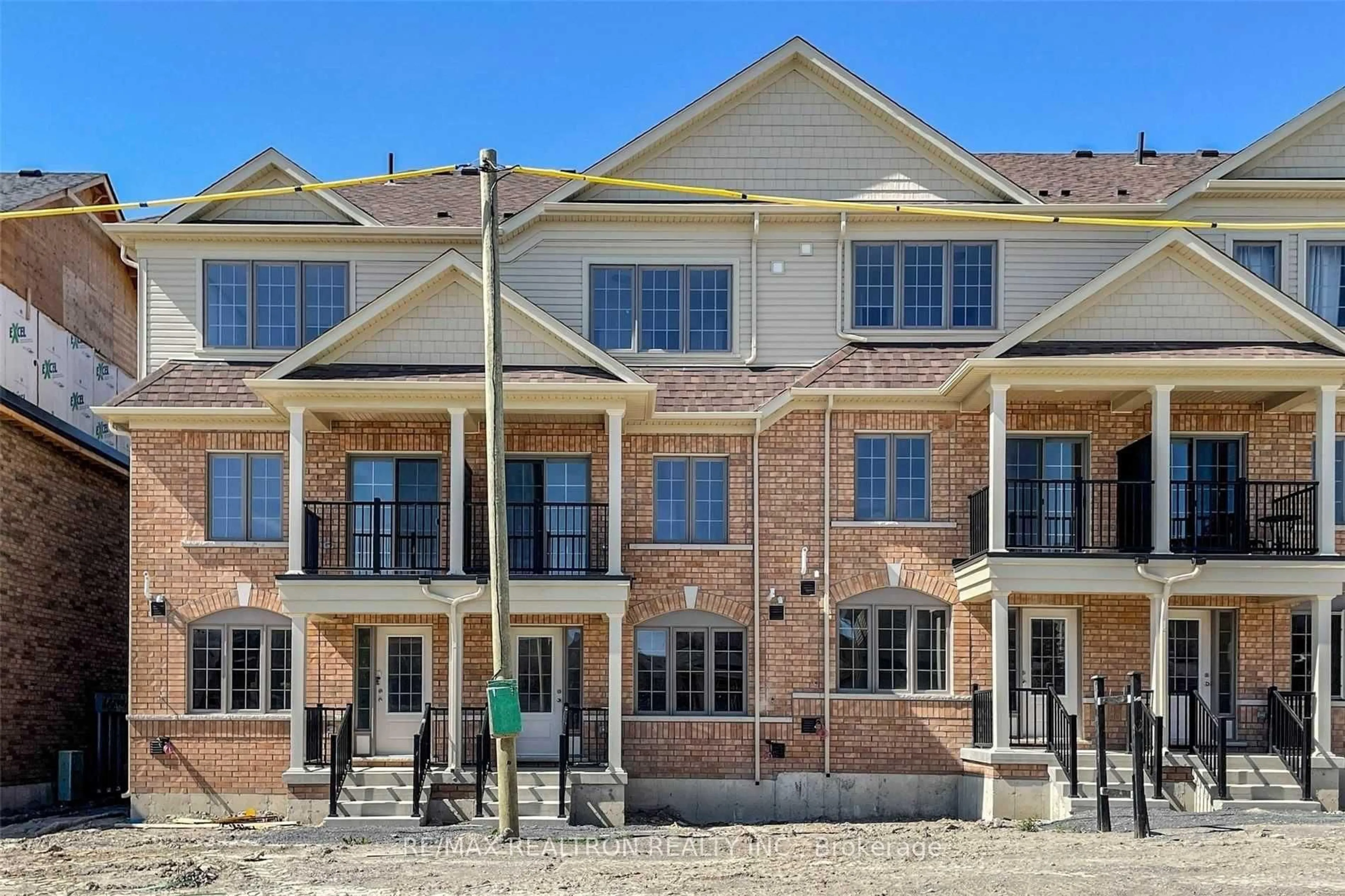 Home with brick exterior material, street for 203 Royal Northern Path #73, Oshawa Ontario L1L 0R6