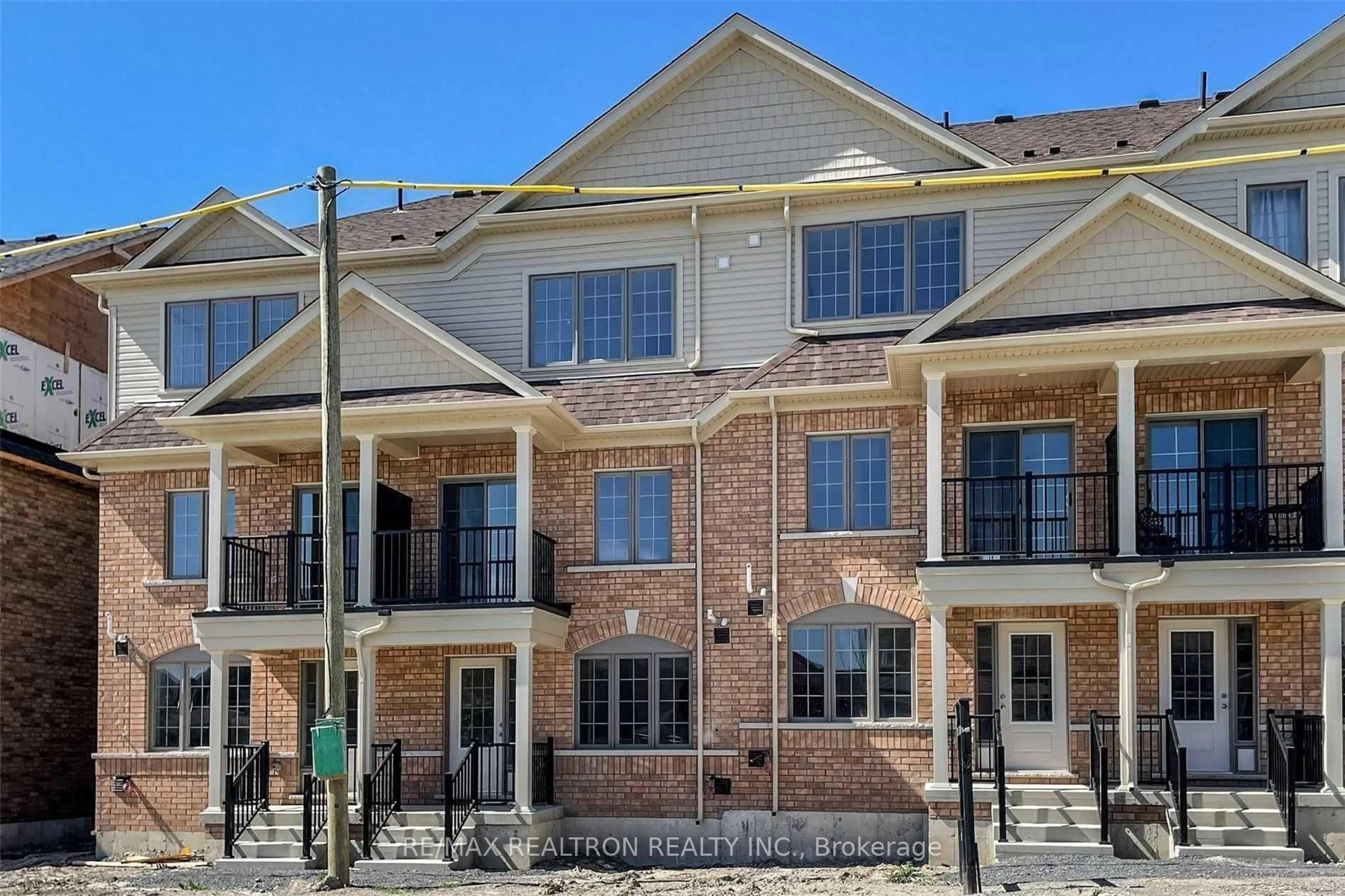 Home with brick exterior material, street for 203 Royal Northern Path #73, Oshawa Ontario L1L 0R6