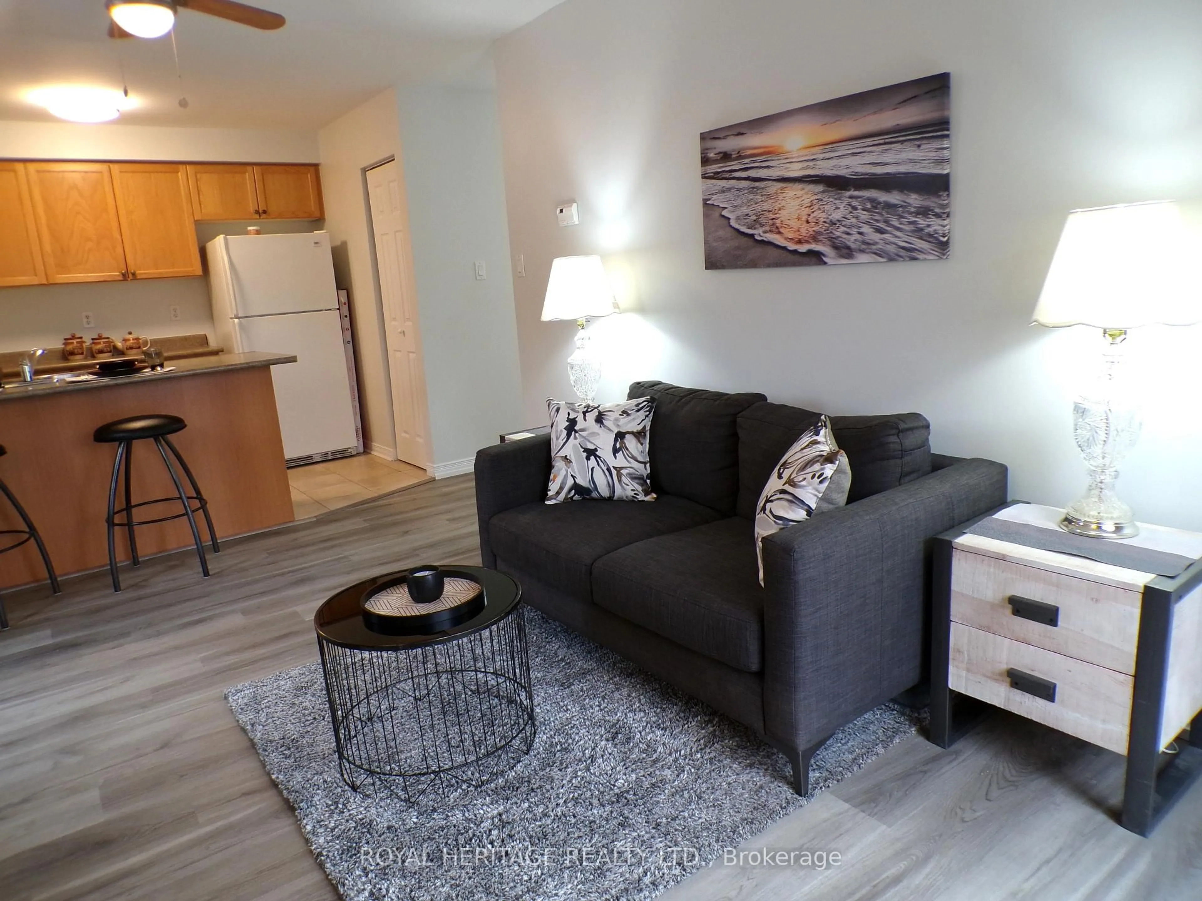 Living room with furniture, wood/laminate floor for 94 Aspen Springs Dr #106, Clarington Ontario L1C 5N4