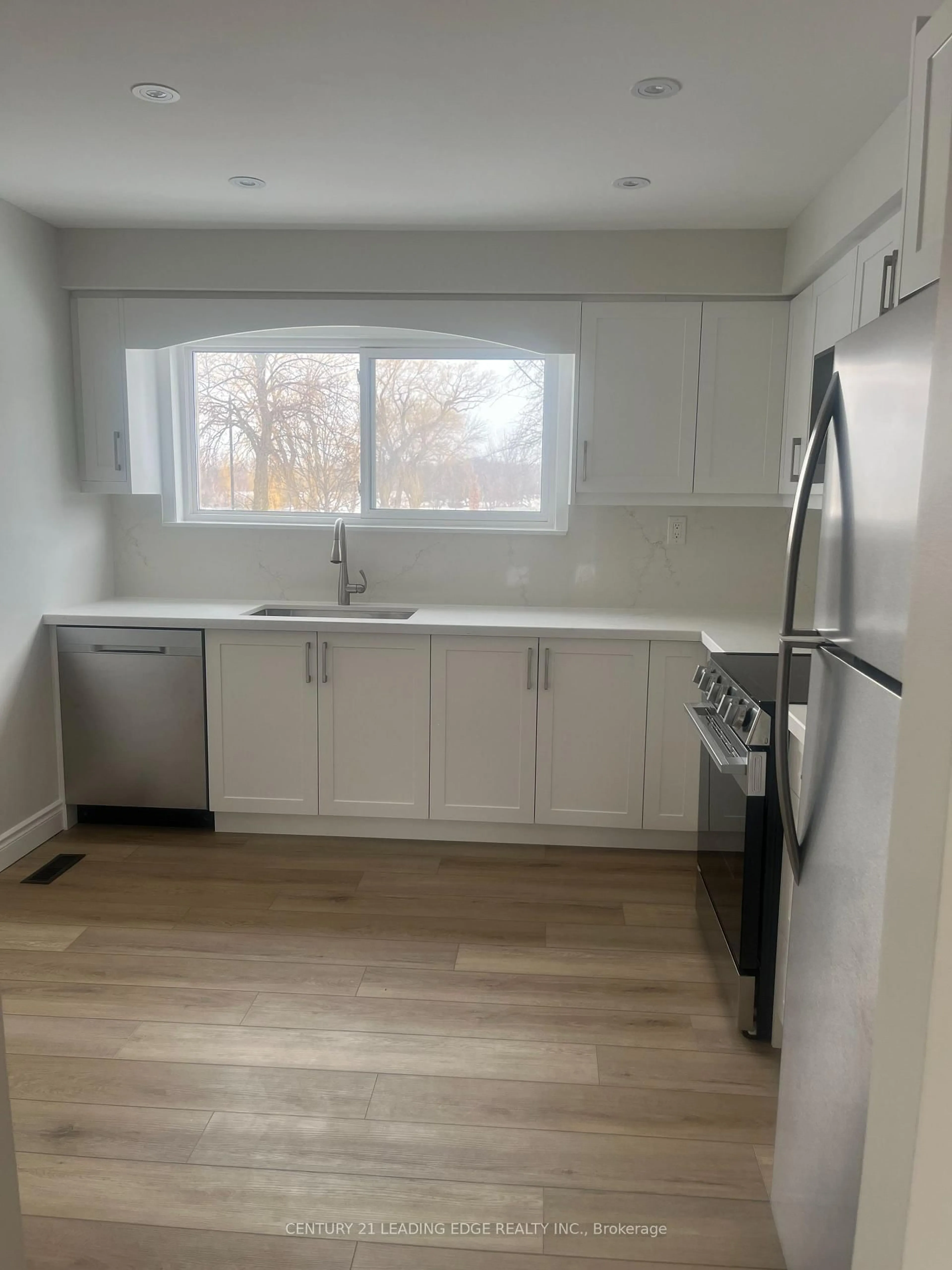 Open concept kitchen, wood/laminate floor for 24 King Henrys Blvd, Toronto Ontario M1T 2V4
