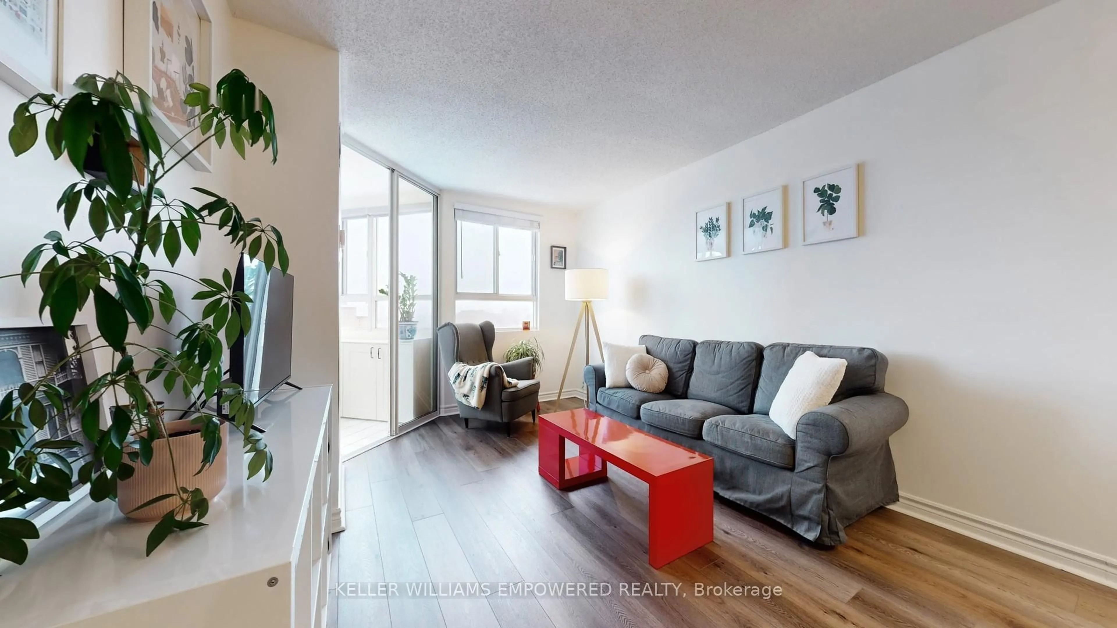 Living room with furniture, wood/laminate floor for 4 Park Vista Cres #1403, Toronto Ontario M4B 3M8
