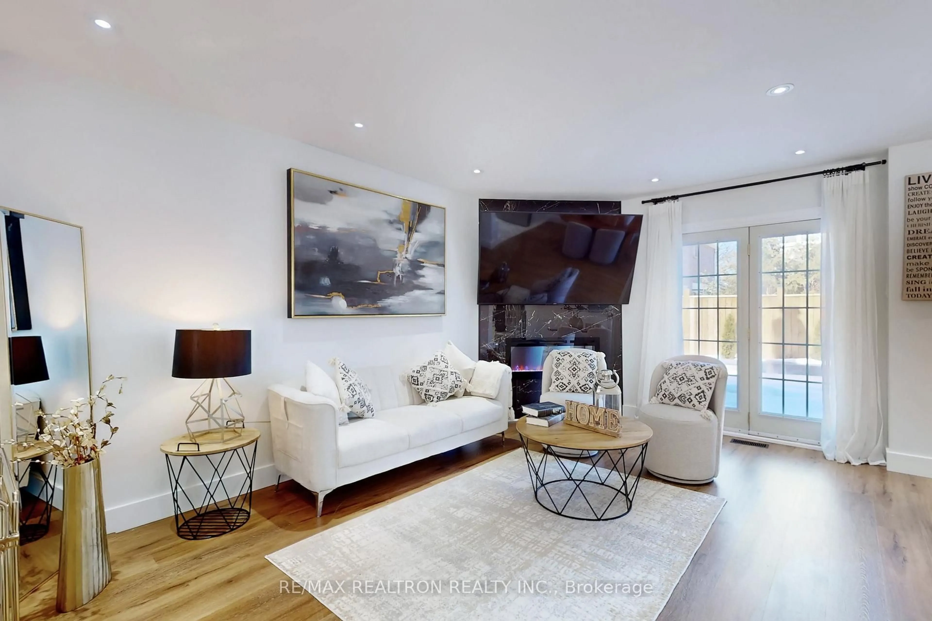 Living room with furniture, wood/laminate floor for 35 Carnelly Cres, Ajax Ontario L1T 2H5