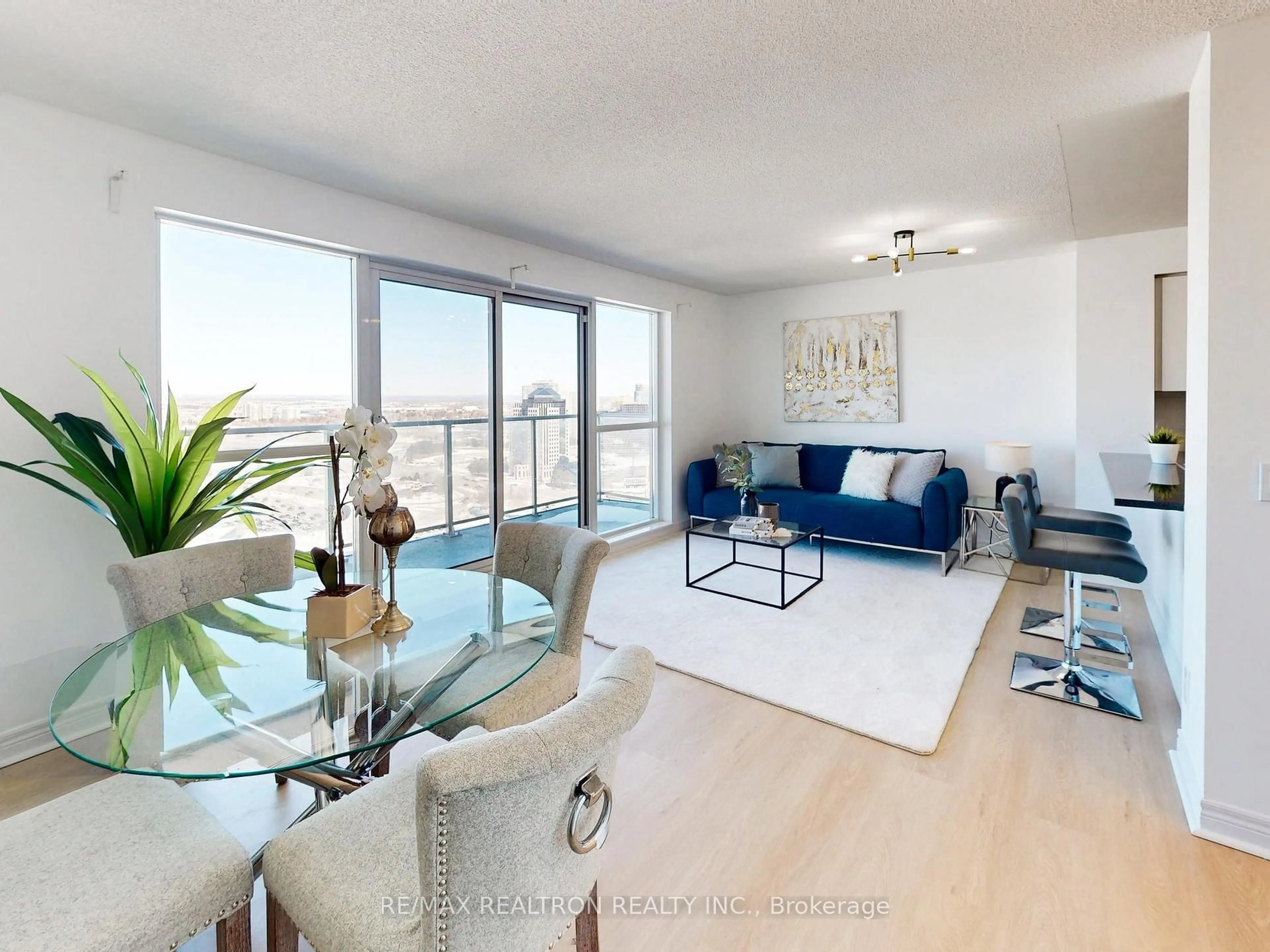 Living room with furniture, wood/laminate floor for 70 Town Centre Crt #2501, Toronto Ontario M1P 0B2