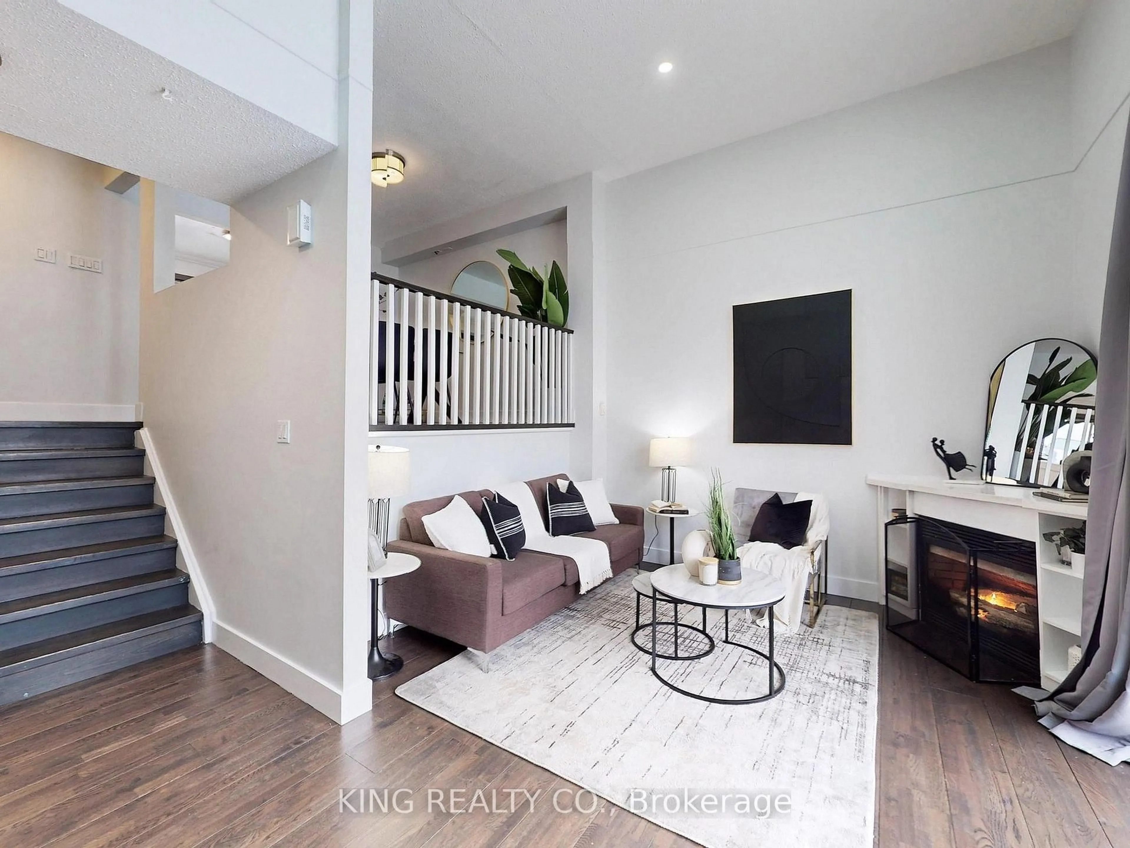 Living room with furniture, wood/laminate floor for 1975 Rosefield Rd #83, Pickering Ontario L1V 3E3