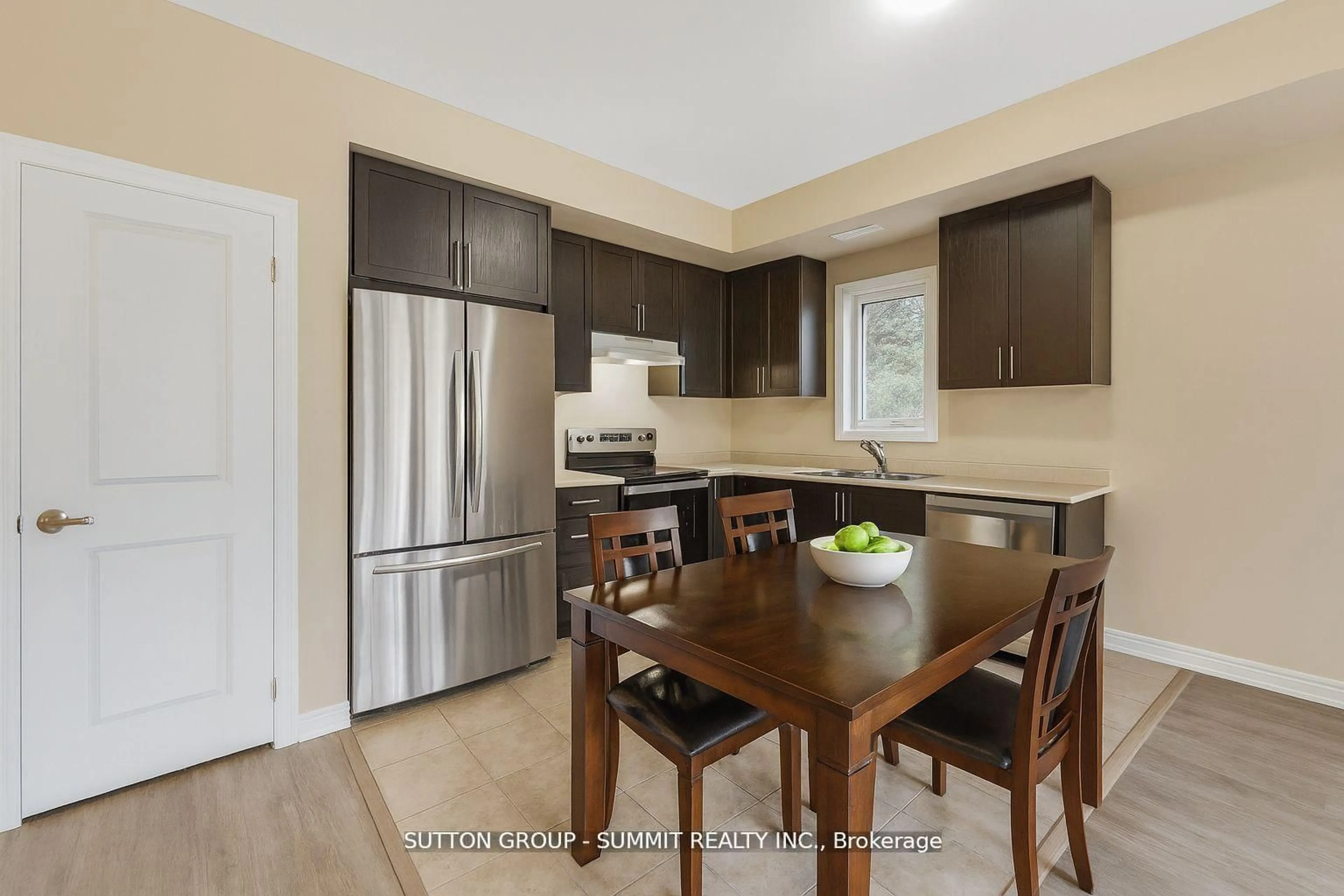 Open concept kitchen, wood/laminate floor for 293 Olive Ave, Oshawa Ontario L1H 2P5