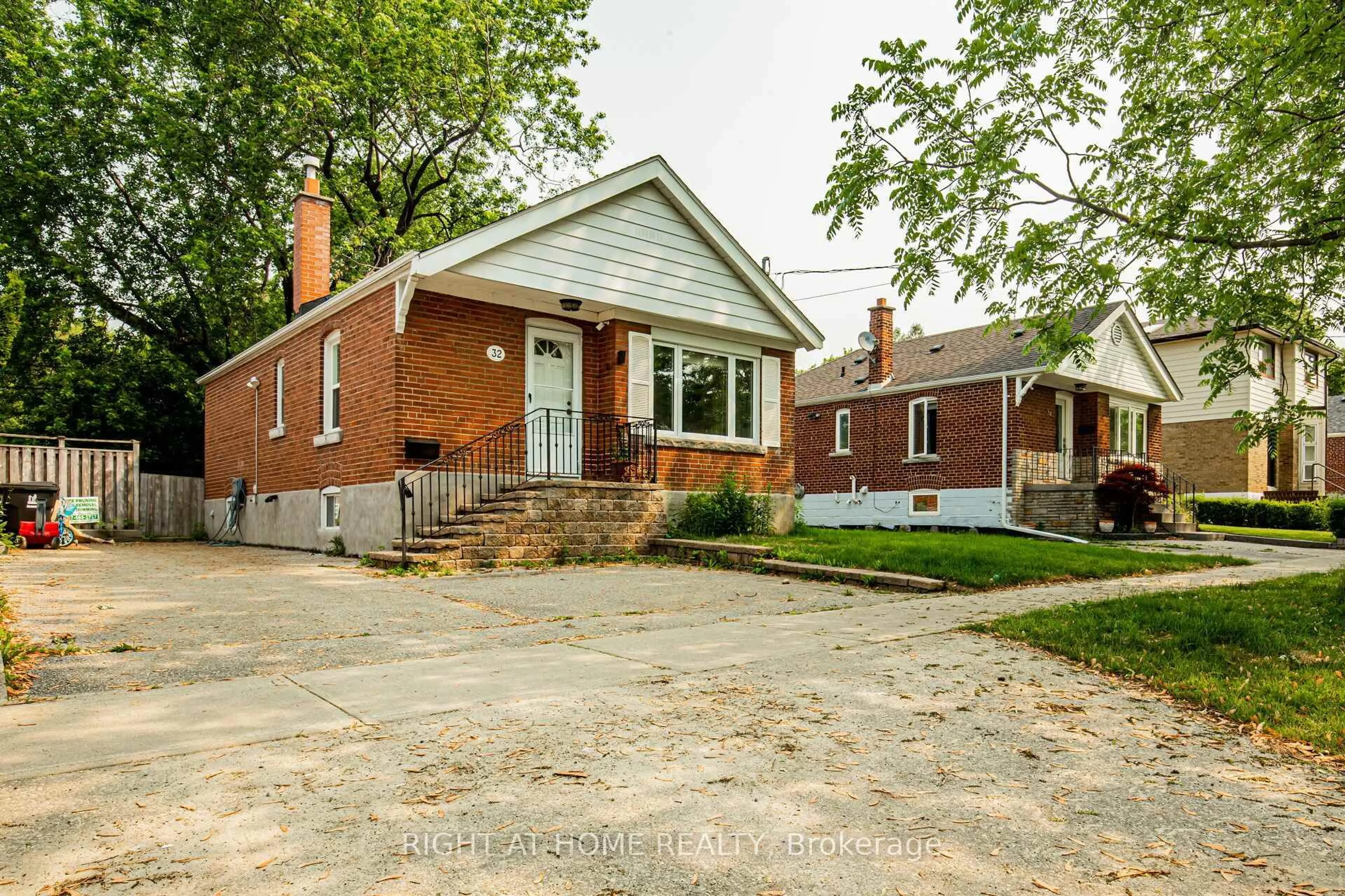 Home with brick exterior material, street for 32 Florens Ave, Toronto Ontario M1L 1R6