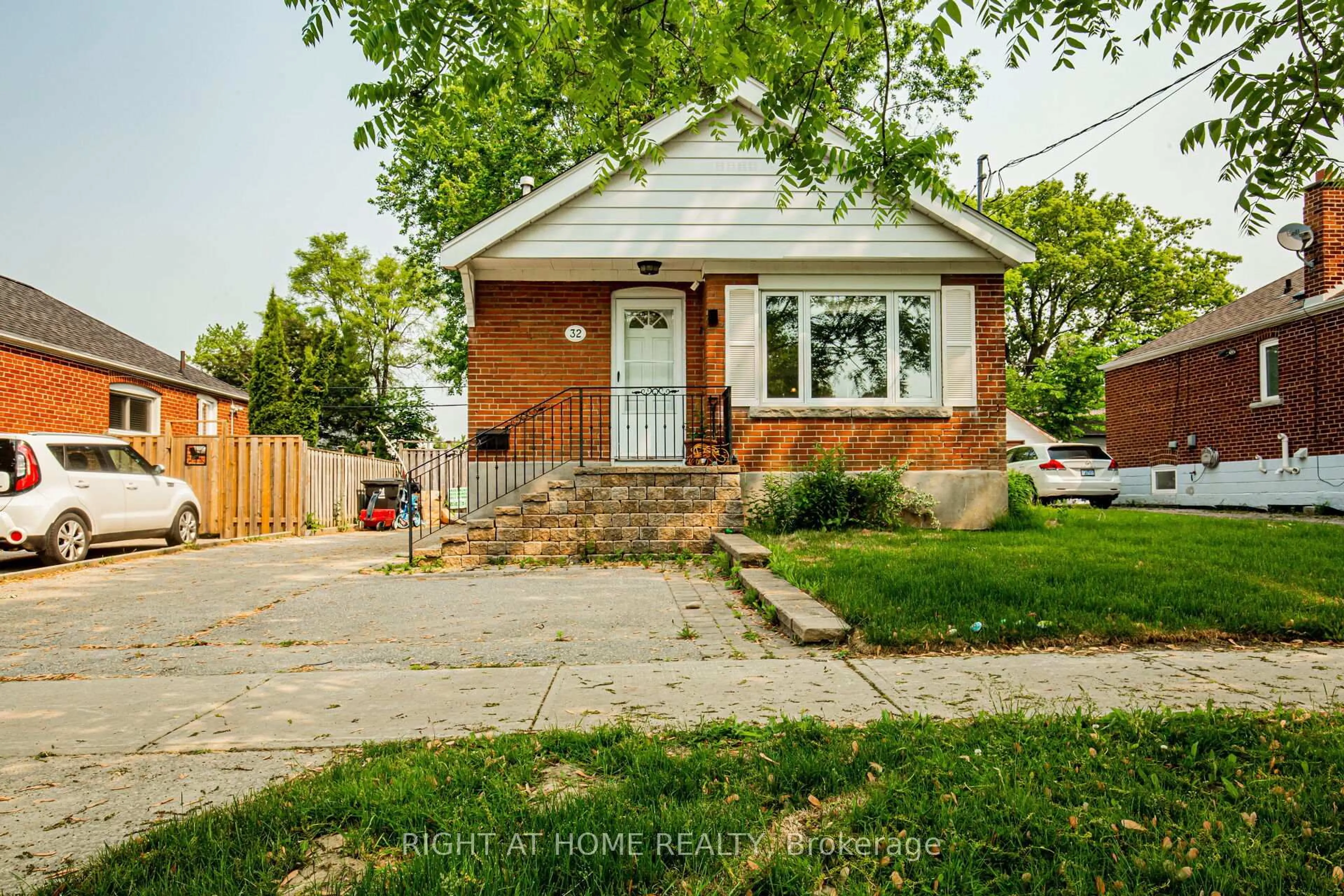 Home with brick exterior material, street for 32 Florens Ave, Toronto Ontario M1L 1R6
