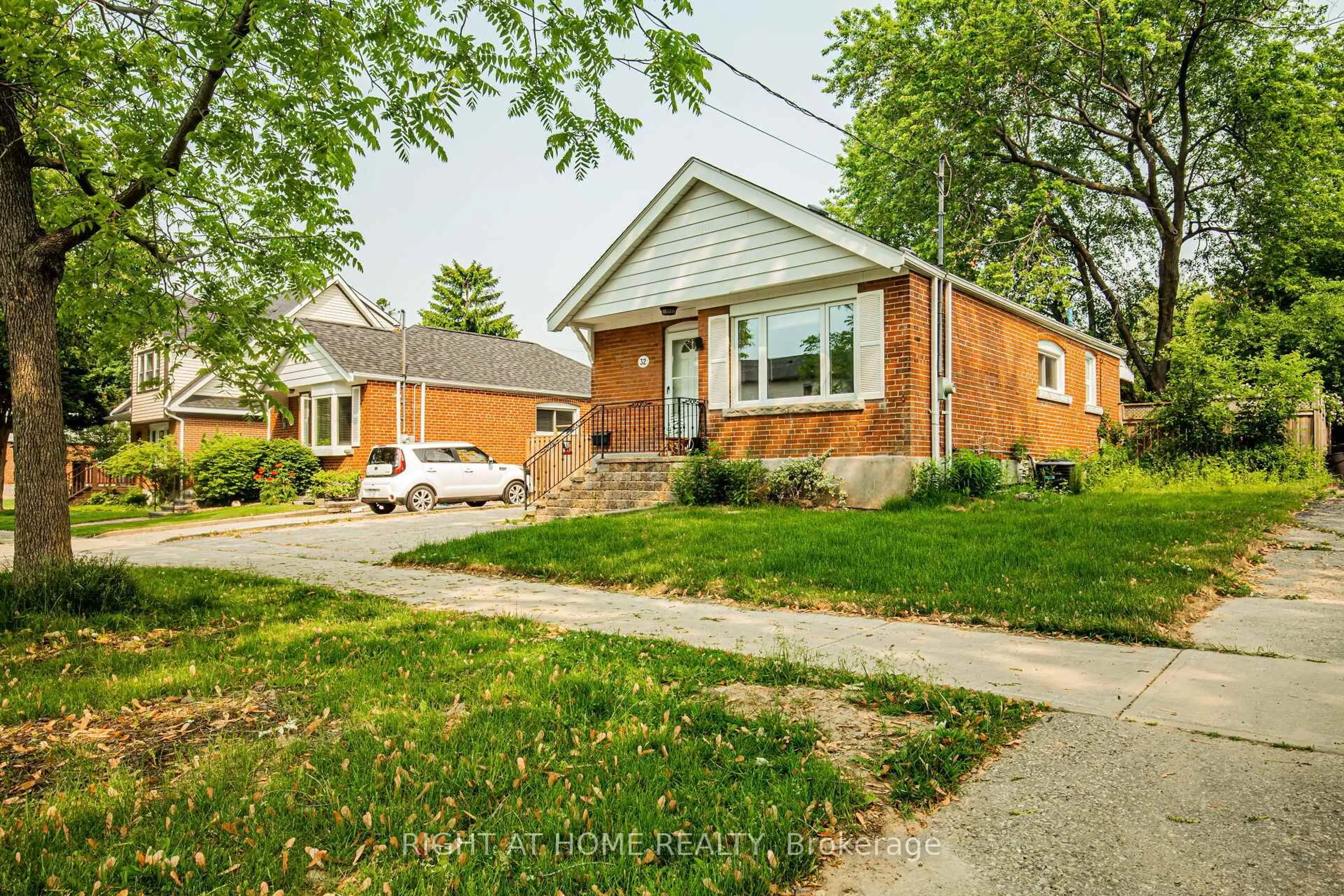 Home with brick exterior material, street for 32 Florens Ave, Toronto Ontario M1L 1R6