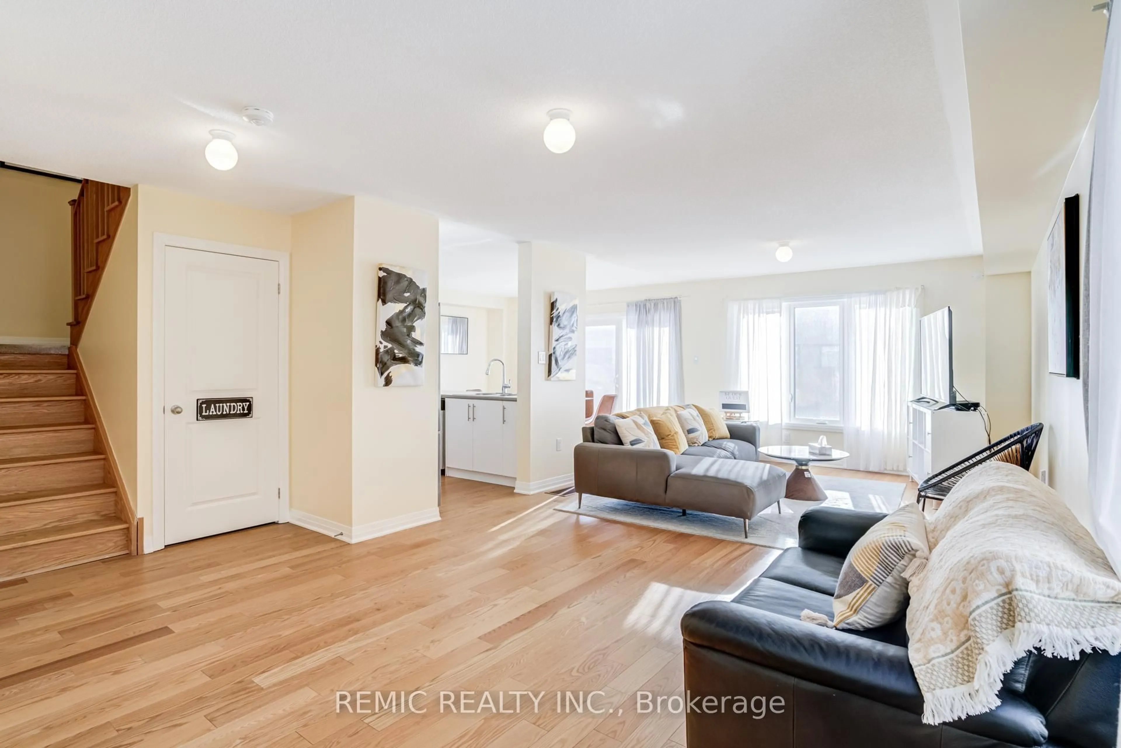 Living room with furniture, wood/laminate floor for 36 Sailors Landing, Clarington Ontario L1C 7G4