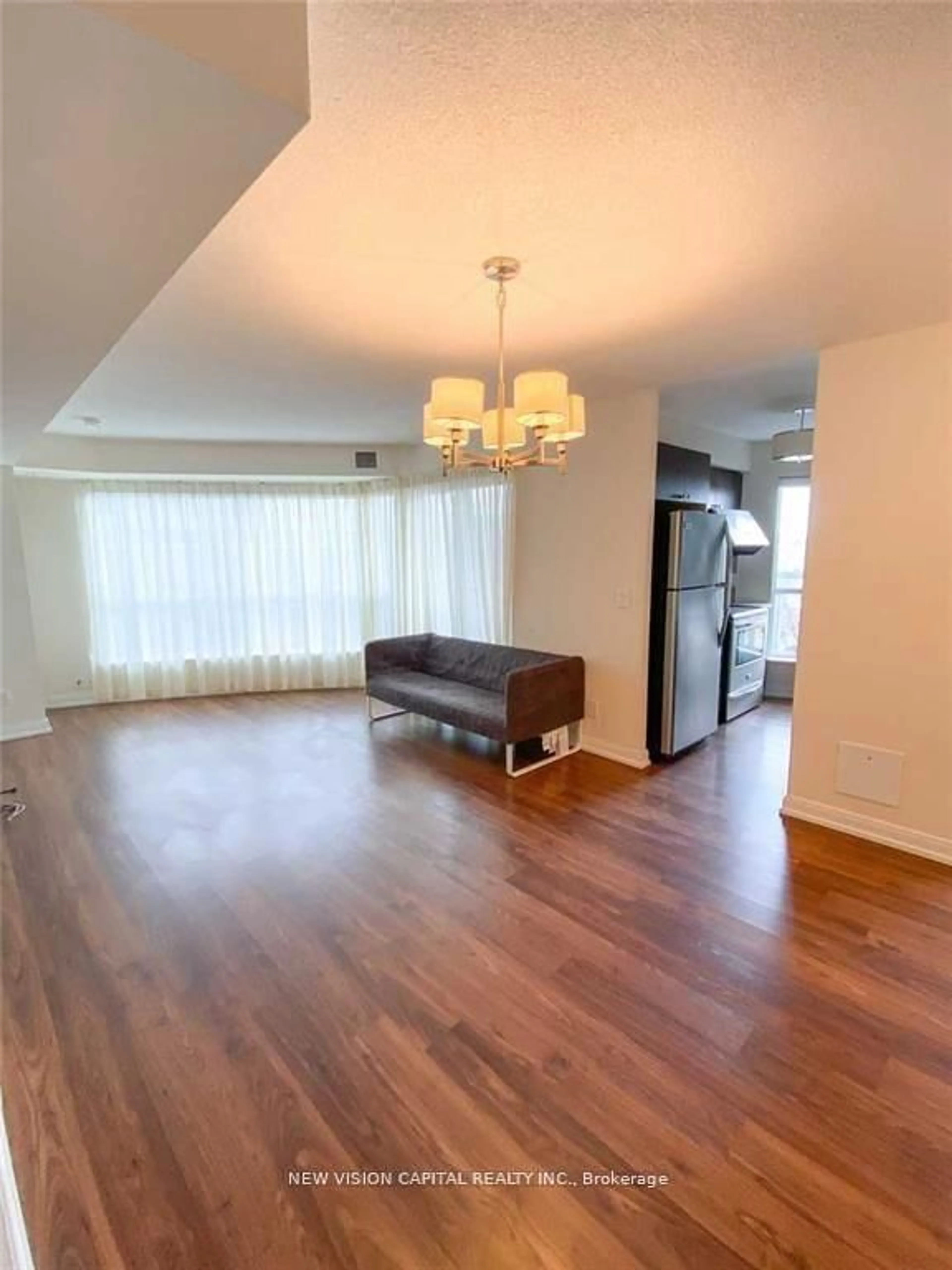 Living room with furniture, wood/laminate floor for 151 Village Green Sq #508, Toronto Ontario M1S 0K5