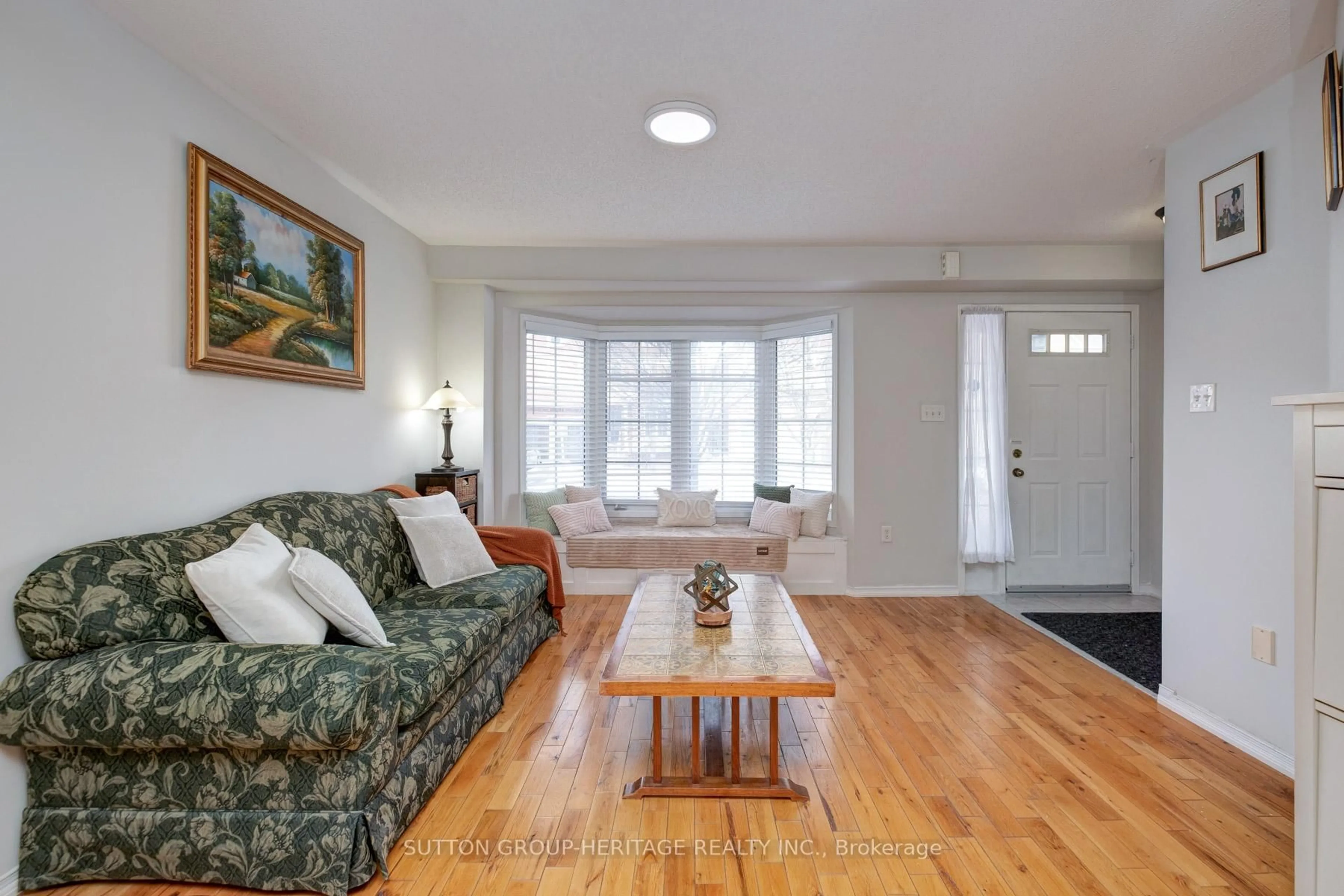 Living room with furniture, wood/laminate floor for 19 Bradbury Cres, Ajax Ontario L1T 4H5