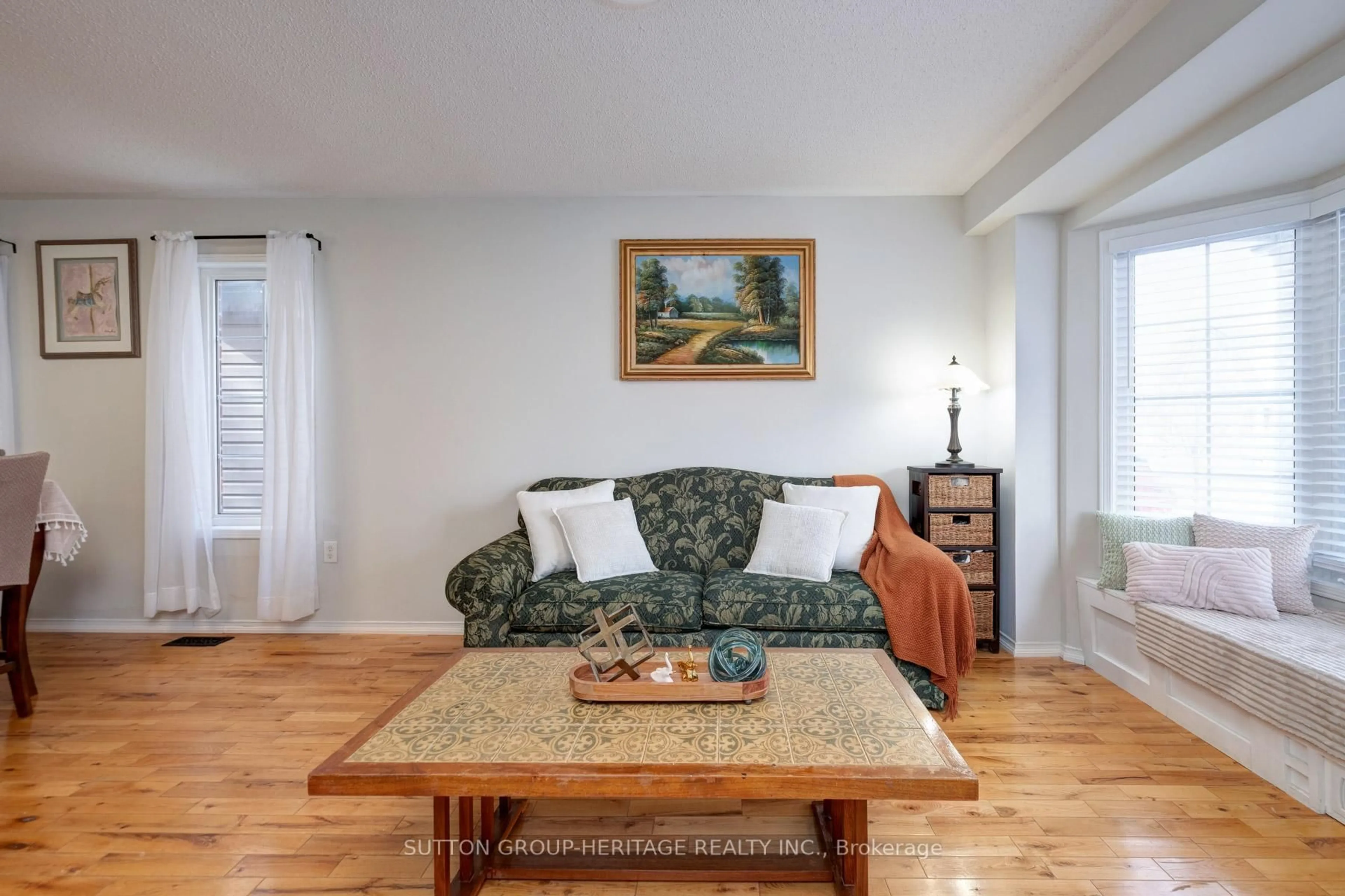 Living room with furniture, wood/laminate floor for 19 Bradbury Cres, Ajax Ontario L1T 4H5