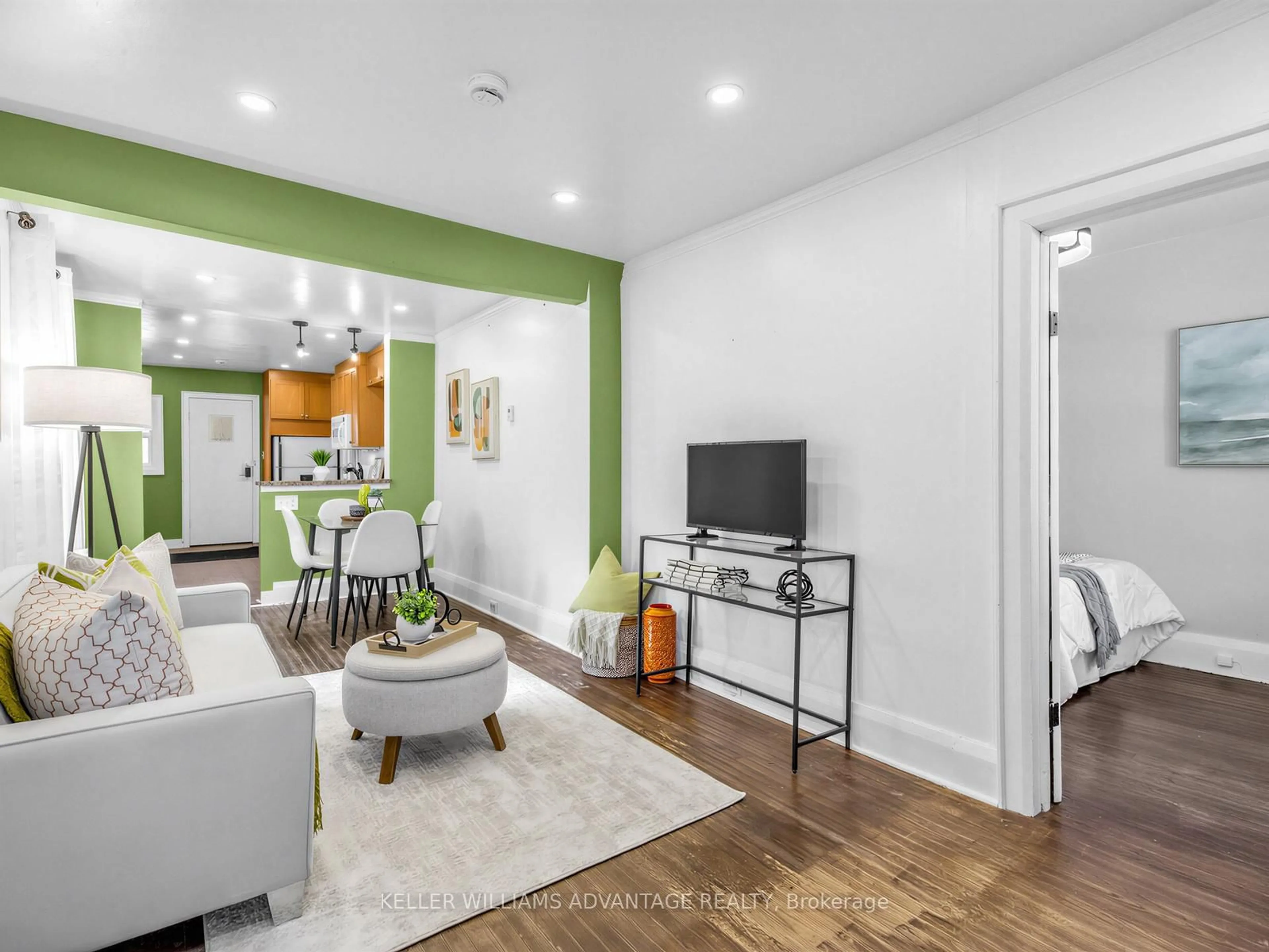 Living room with furniture, wood/laminate floor for 12 Hastings Ave, Toronto Ontario M4L 2L2