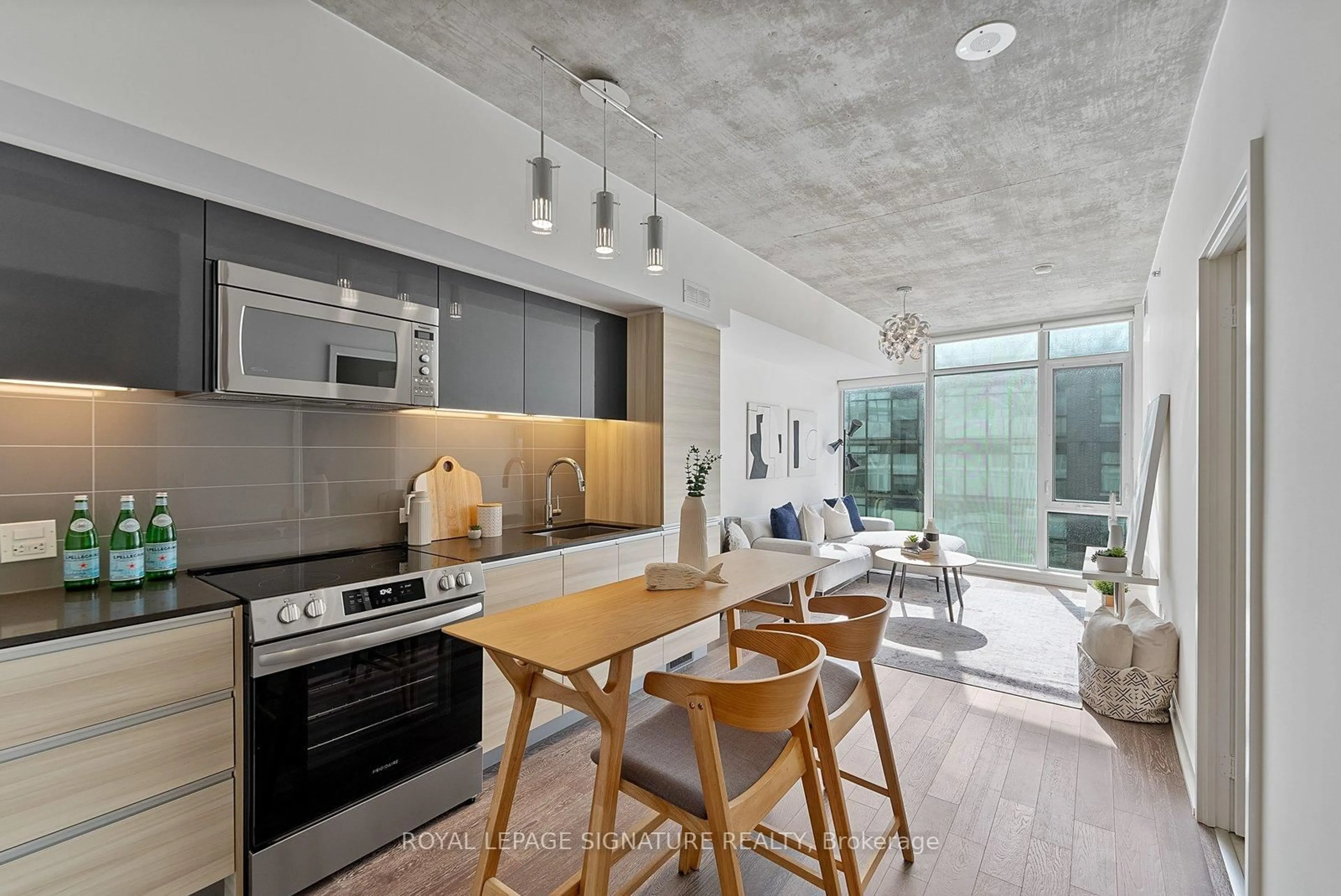 Open concept kitchen, cement floor for 1190 Dundas St #810, Toronto Ontario M4M 0C5