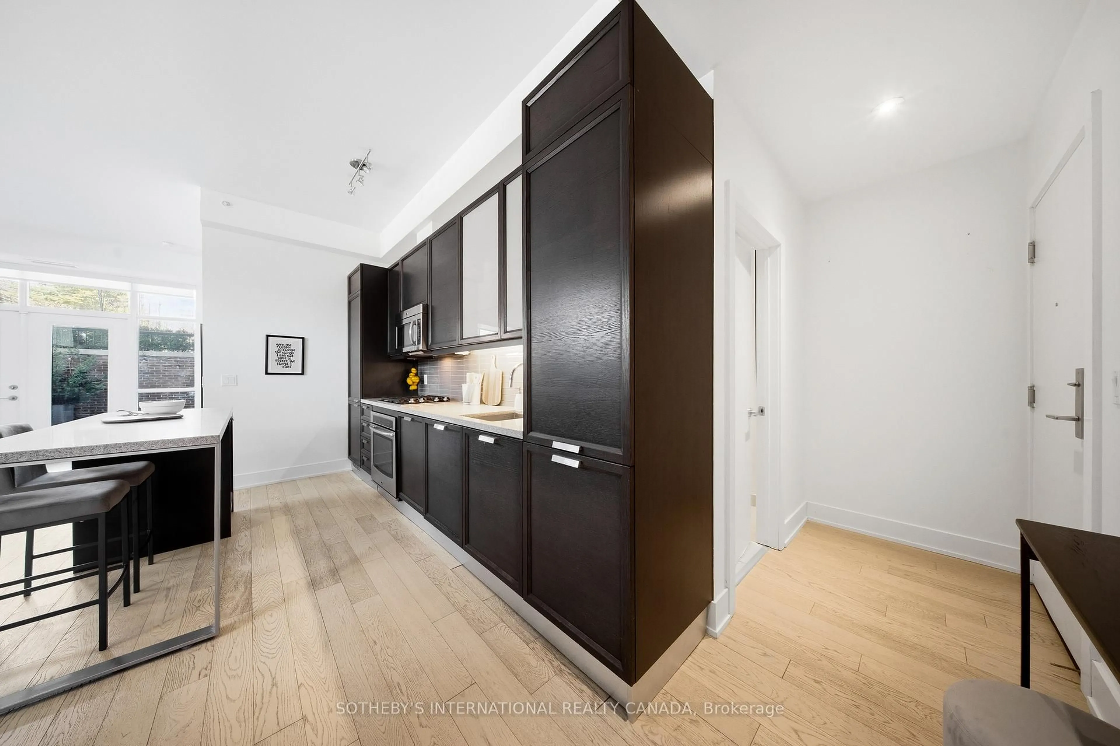 Contemporary kitchen, wood/laminate floor for 66 Kippendavie Ave #110, Toronto Ontario M4L 0A4