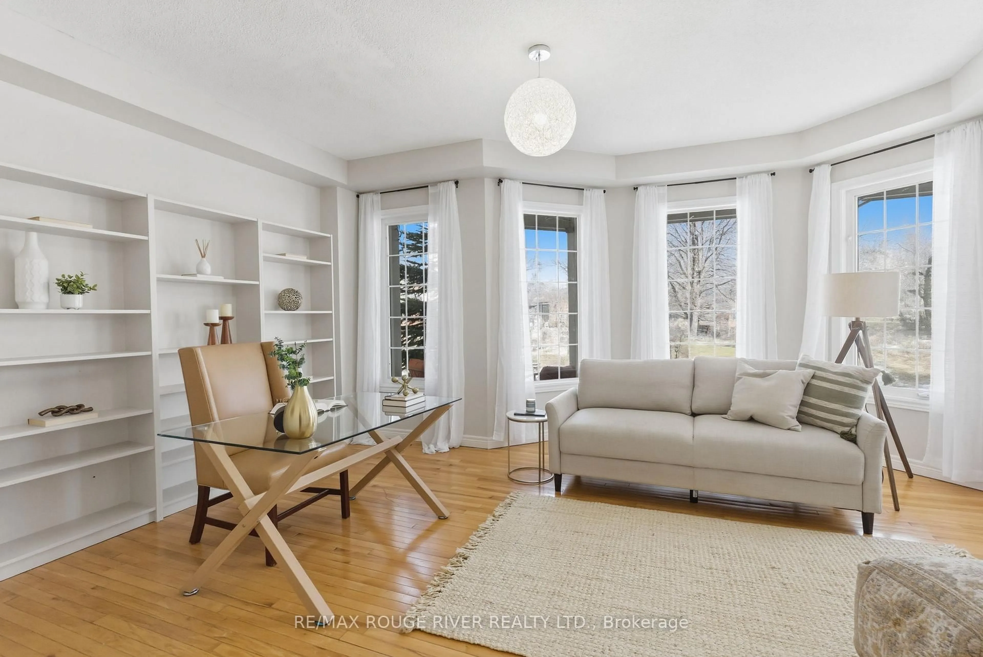 Living room with furniture, wood/laminate floor for 46 Sandford Cres, Whitby Ontario L1R 2R9