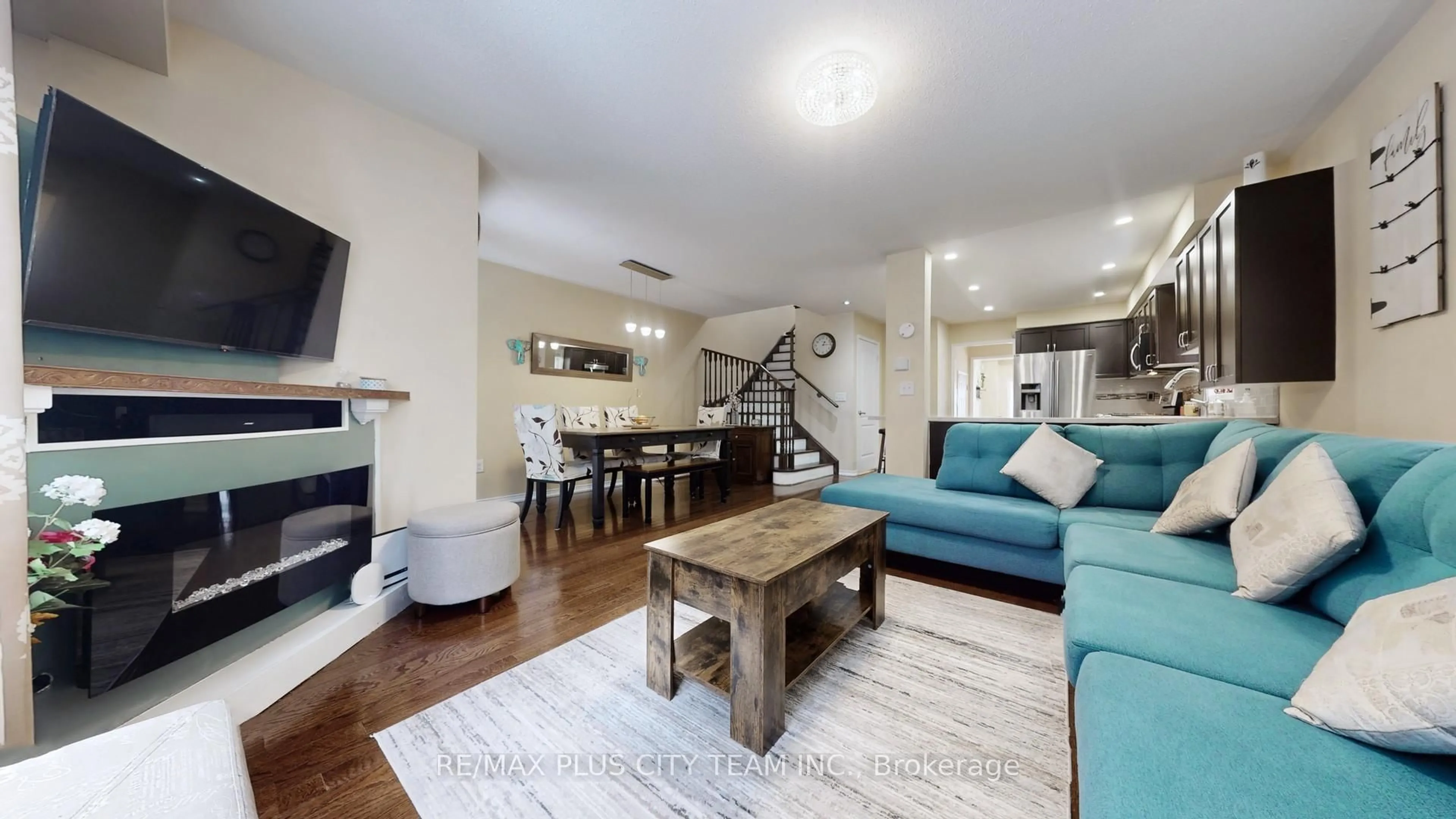 Living room with furniture, wood/laminate floor for 16 Edison Way, Whitby Ontario L1R 0M3