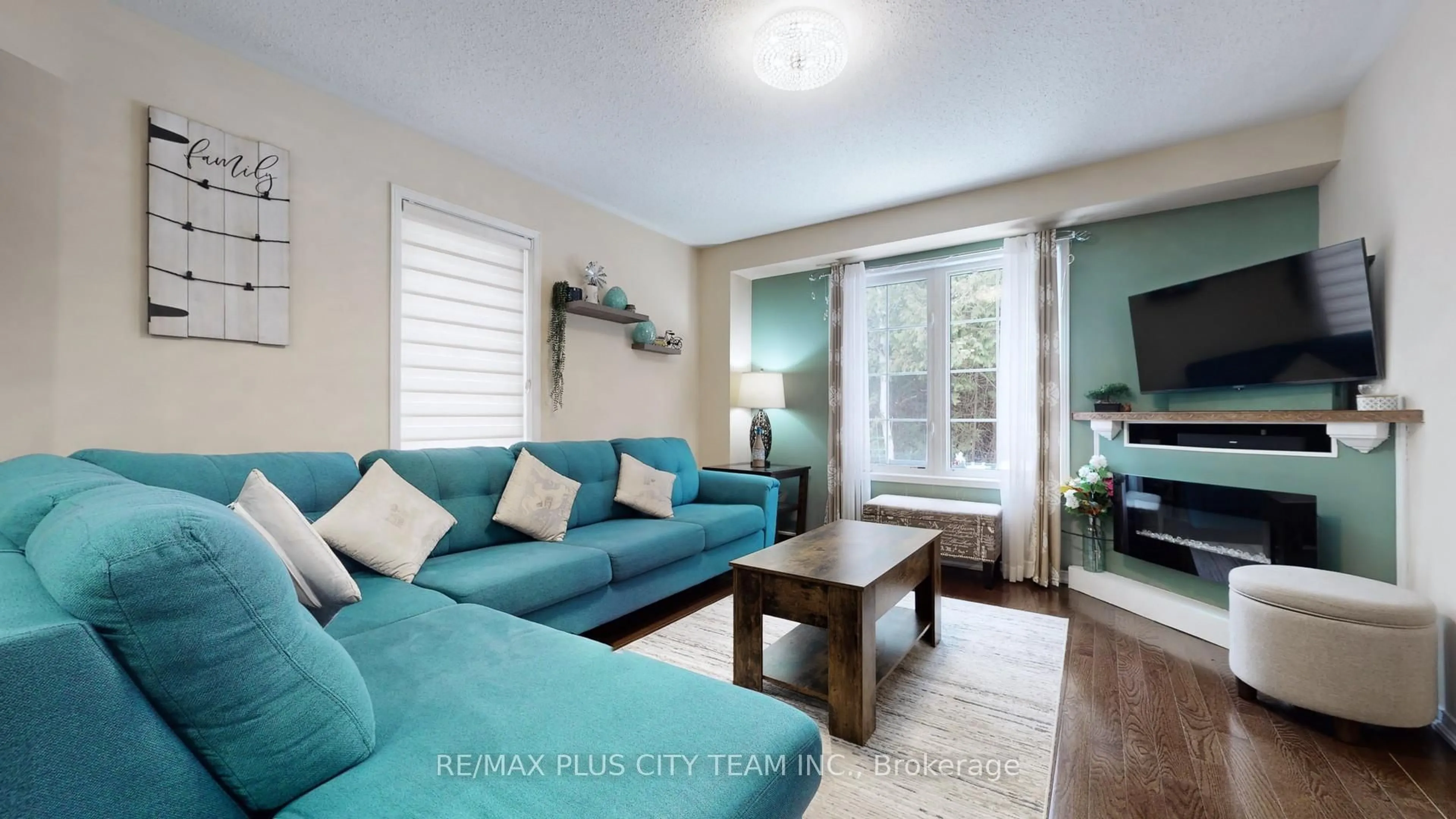 Living room with furniture, wood/laminate floor for 16 Edison Way, Whitby Ontario L1R 0M3