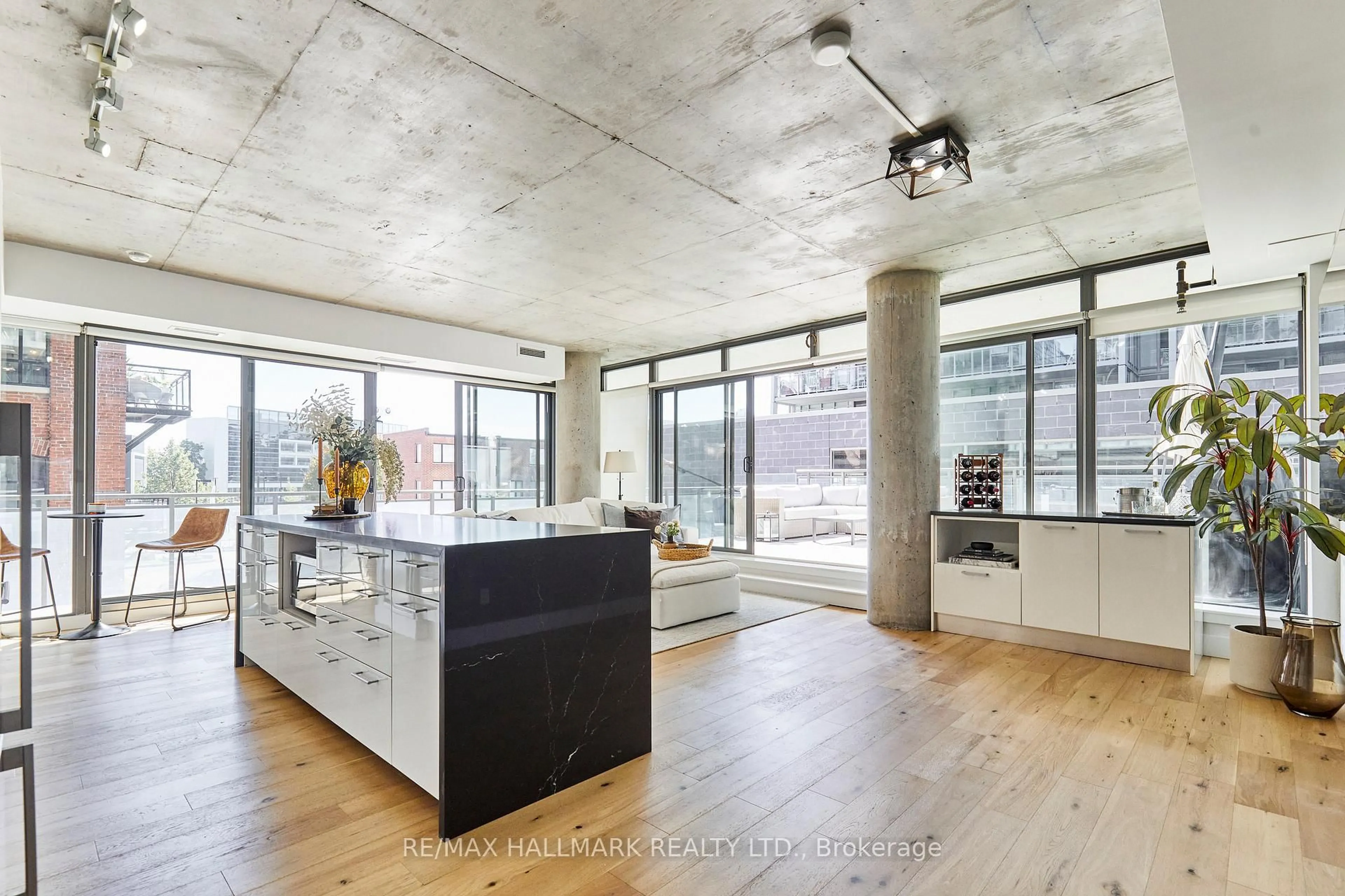 Open concept kitchen, cement floor for 90 Broadview Ave #211, Toronto Ontario M4M 0A7