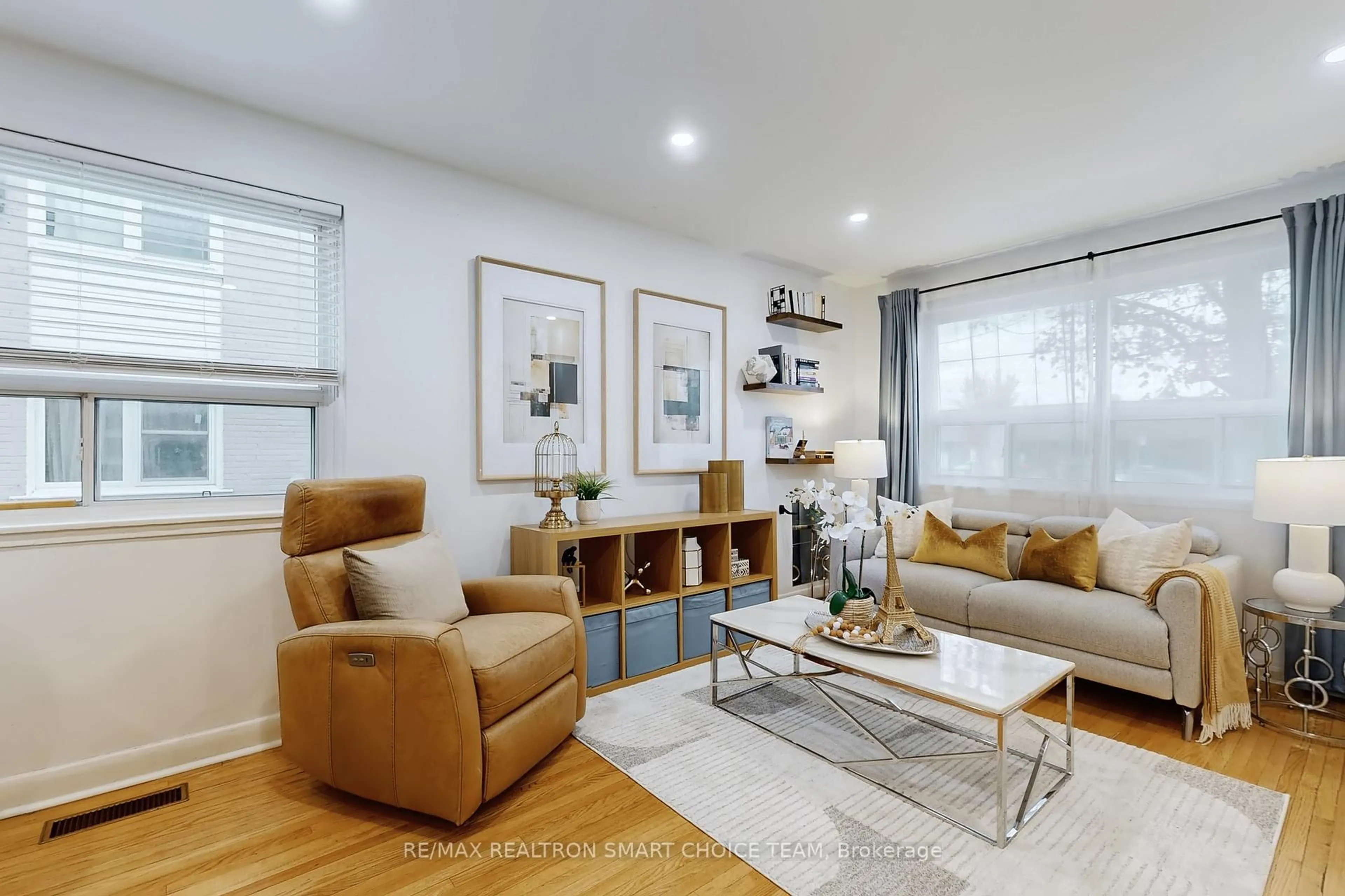 Living room with furniture, wood/laminate floor for 783 Birchmount Rd, Toronto Ontario M1K 1R7