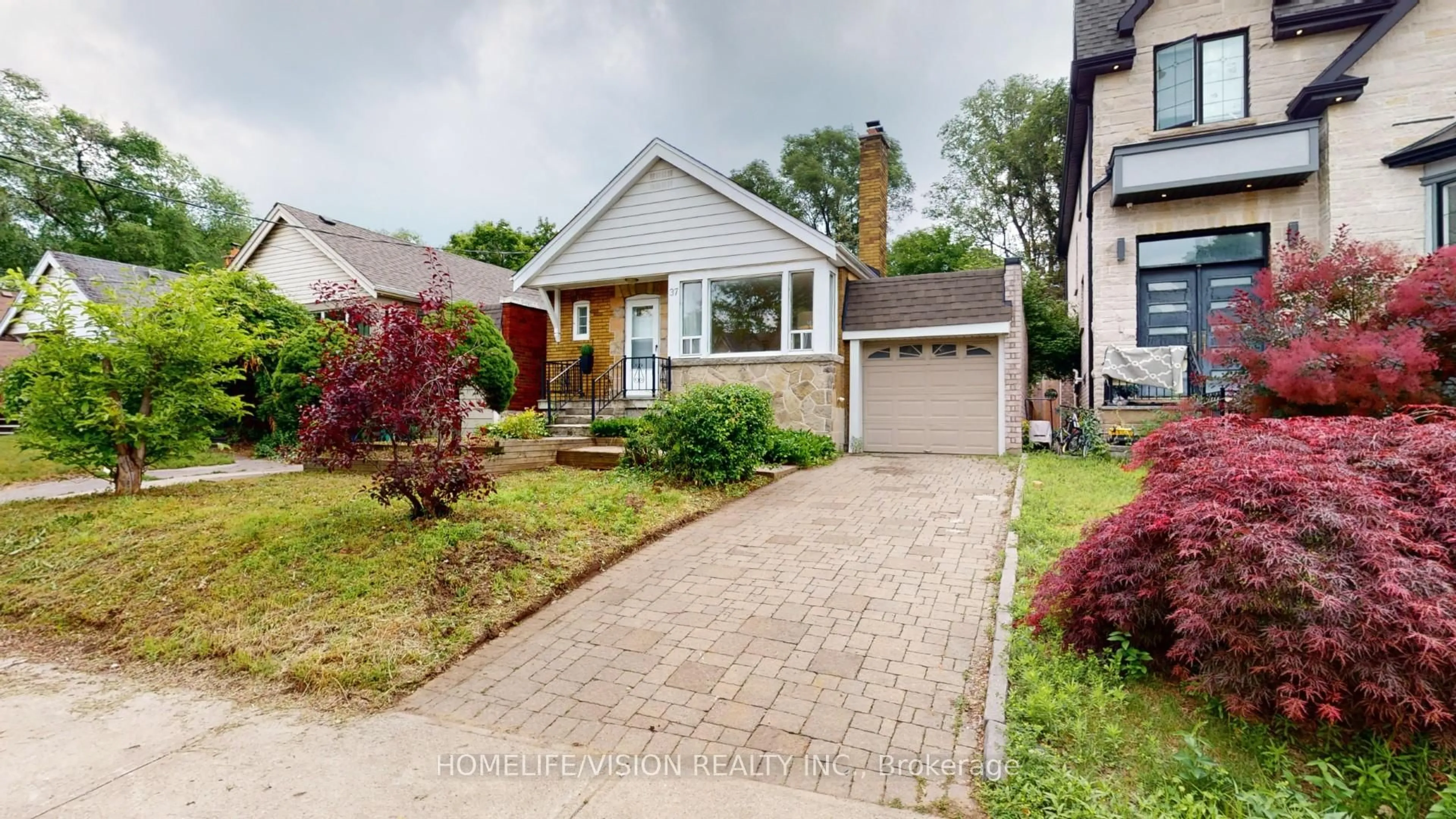 Home with brick exterior material, street for 37 Davies Cres, Toronto Ontario M4J 2X7