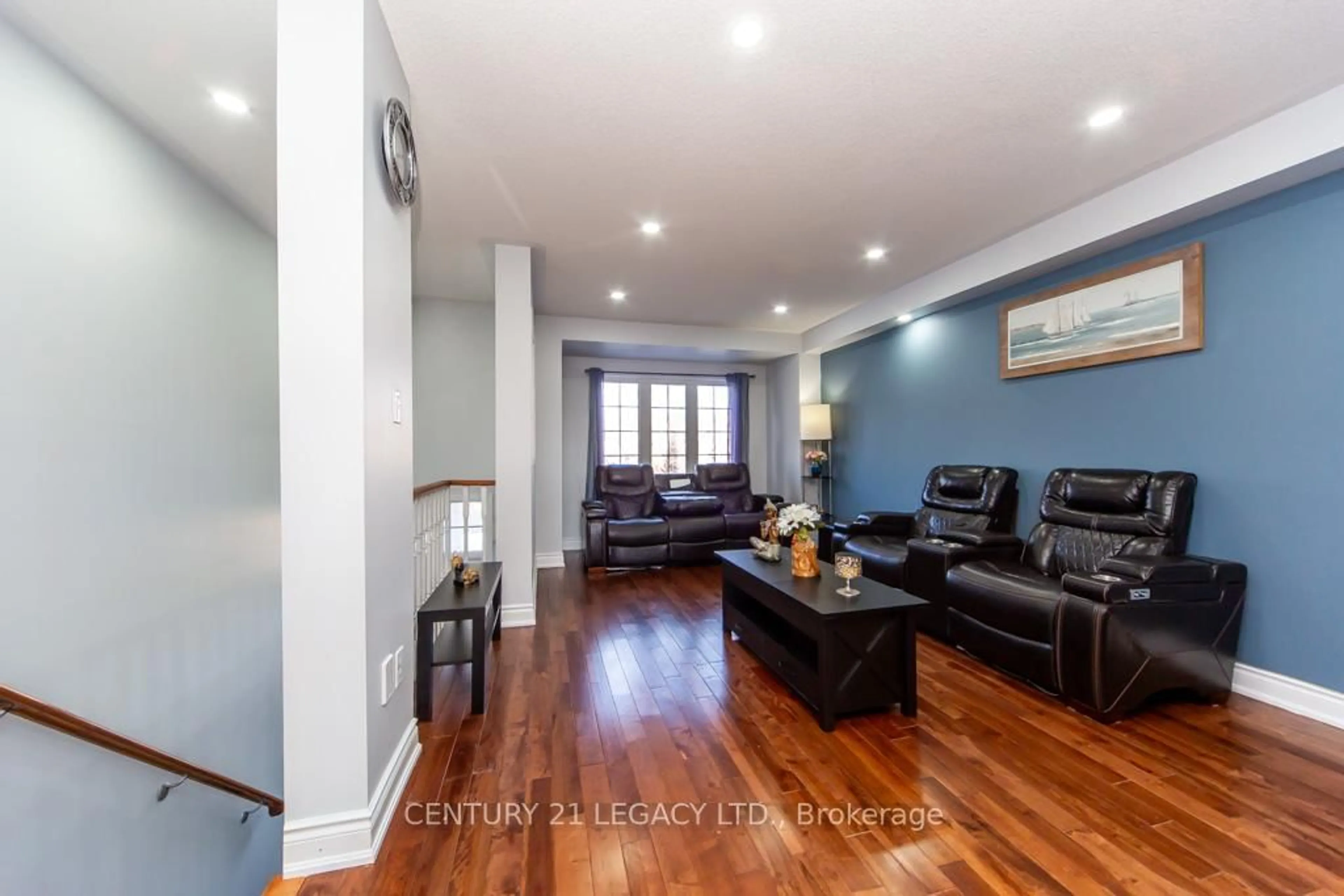 Living room with furniture, wood/laminate floor for 28 Oakins Lane, Ajax Ontario L1T 0H2