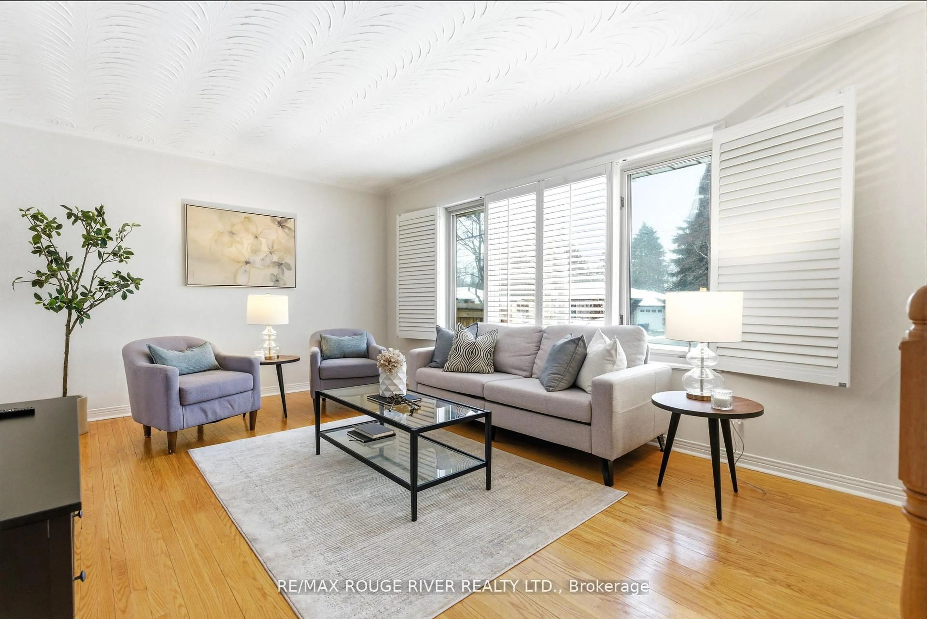 Living room with furniture, wood/laminate floor for 419 Cochrane St, Whitby Ontario L1N 5J6