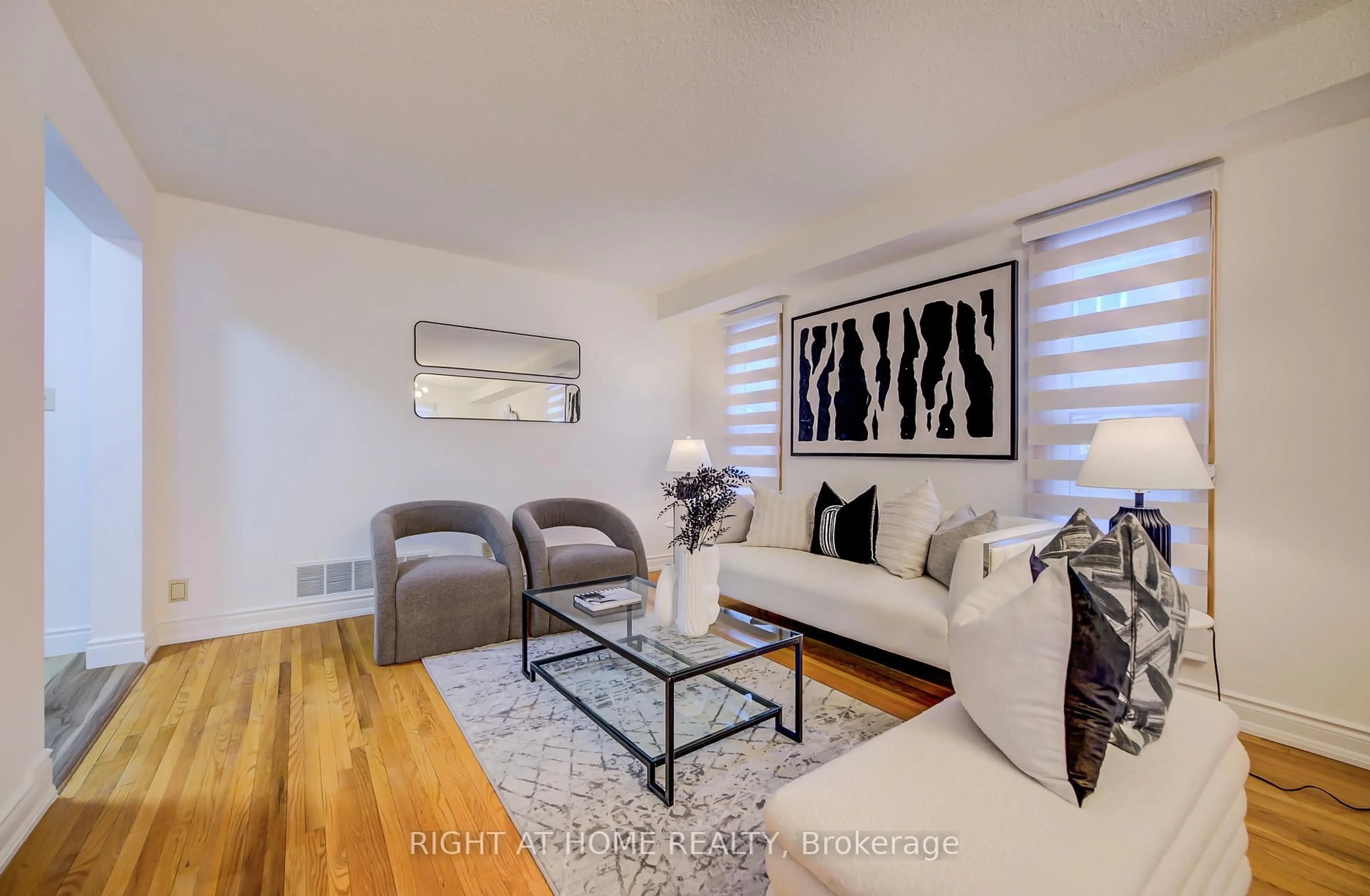 Living room with furniture, wood/laminate floor for 51 Burnt Bark Dr, Toronto Ontario M1V 3J6