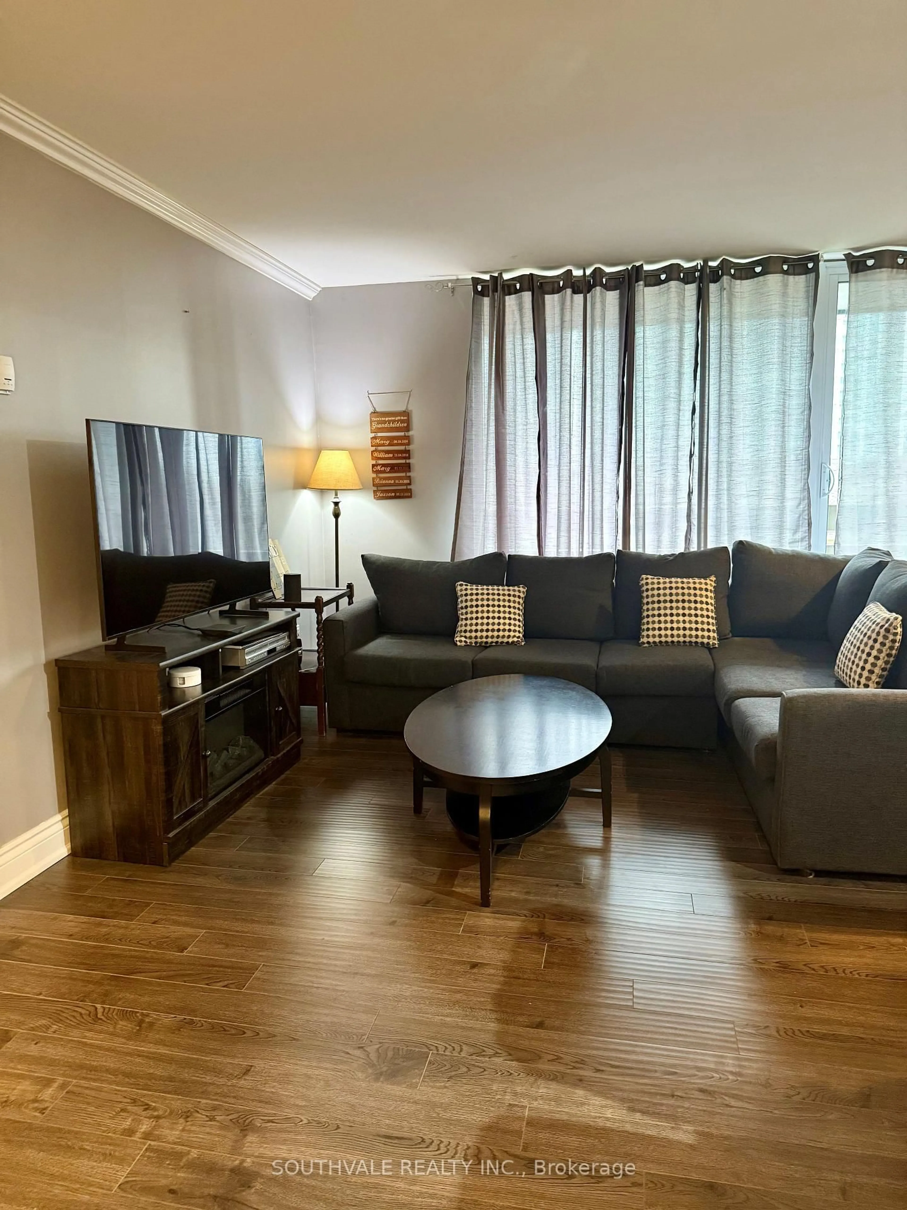 Living room with furniture, wood/laminate floor for 1210 Radom St #601, Pickering Ontario L1W 2Z3