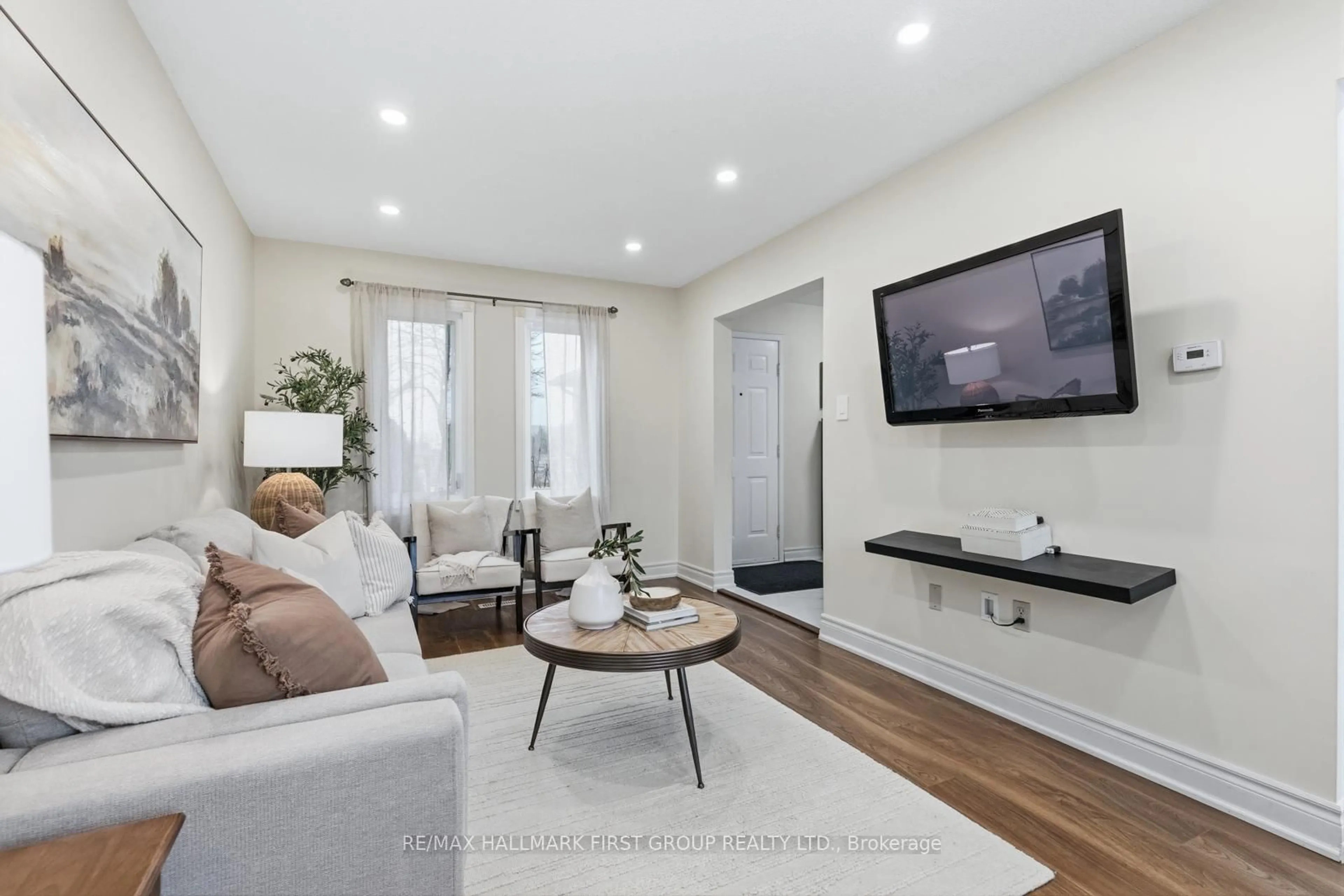 Living room with furniture, wood/laminate floor for 164 Wright Cres, Ajax Ontario L1S 6X5