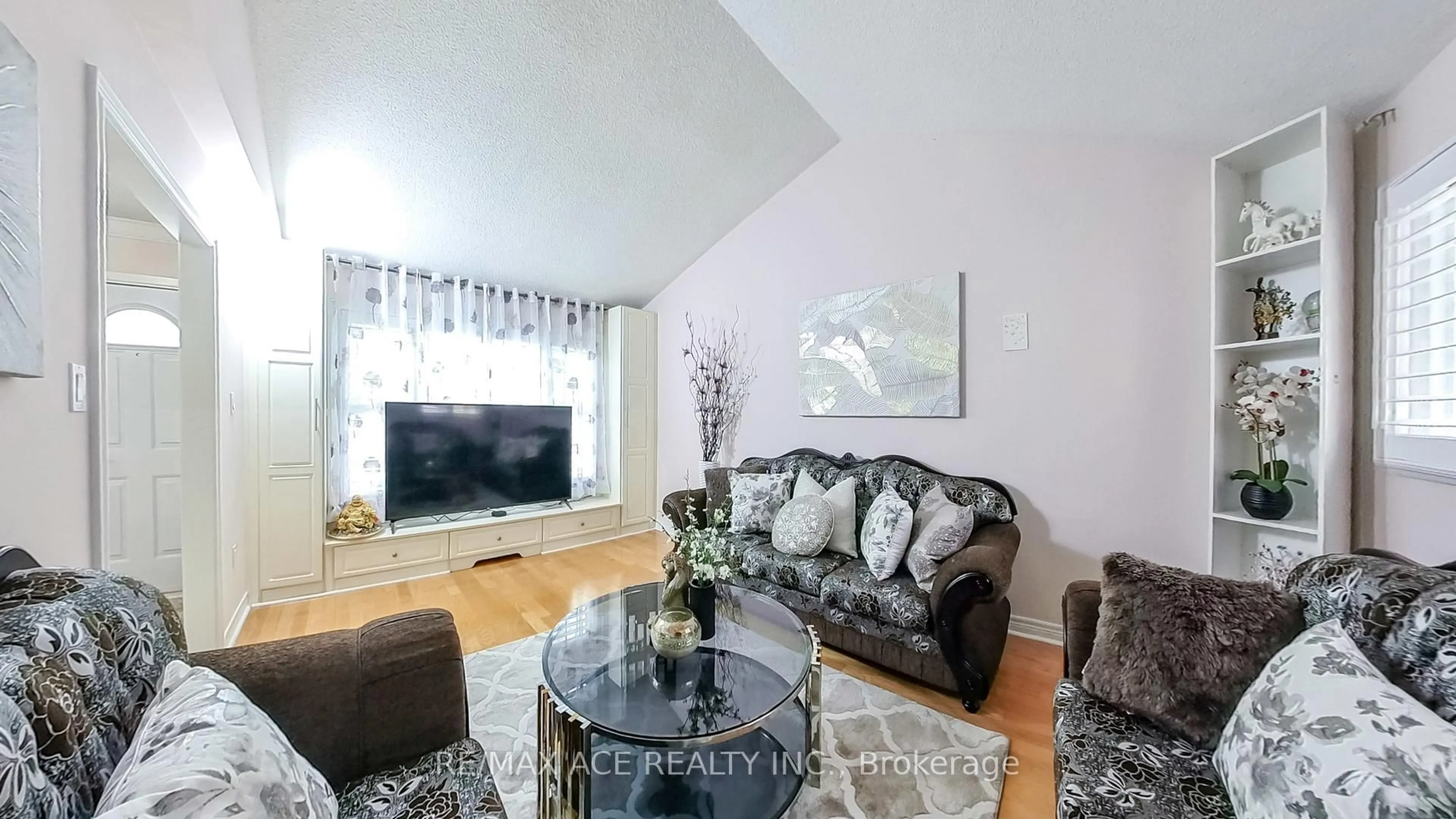 Living room with furniture, wood/laminate floor for 15 Brennan Rd, Ajax Ontario L1T 2G1