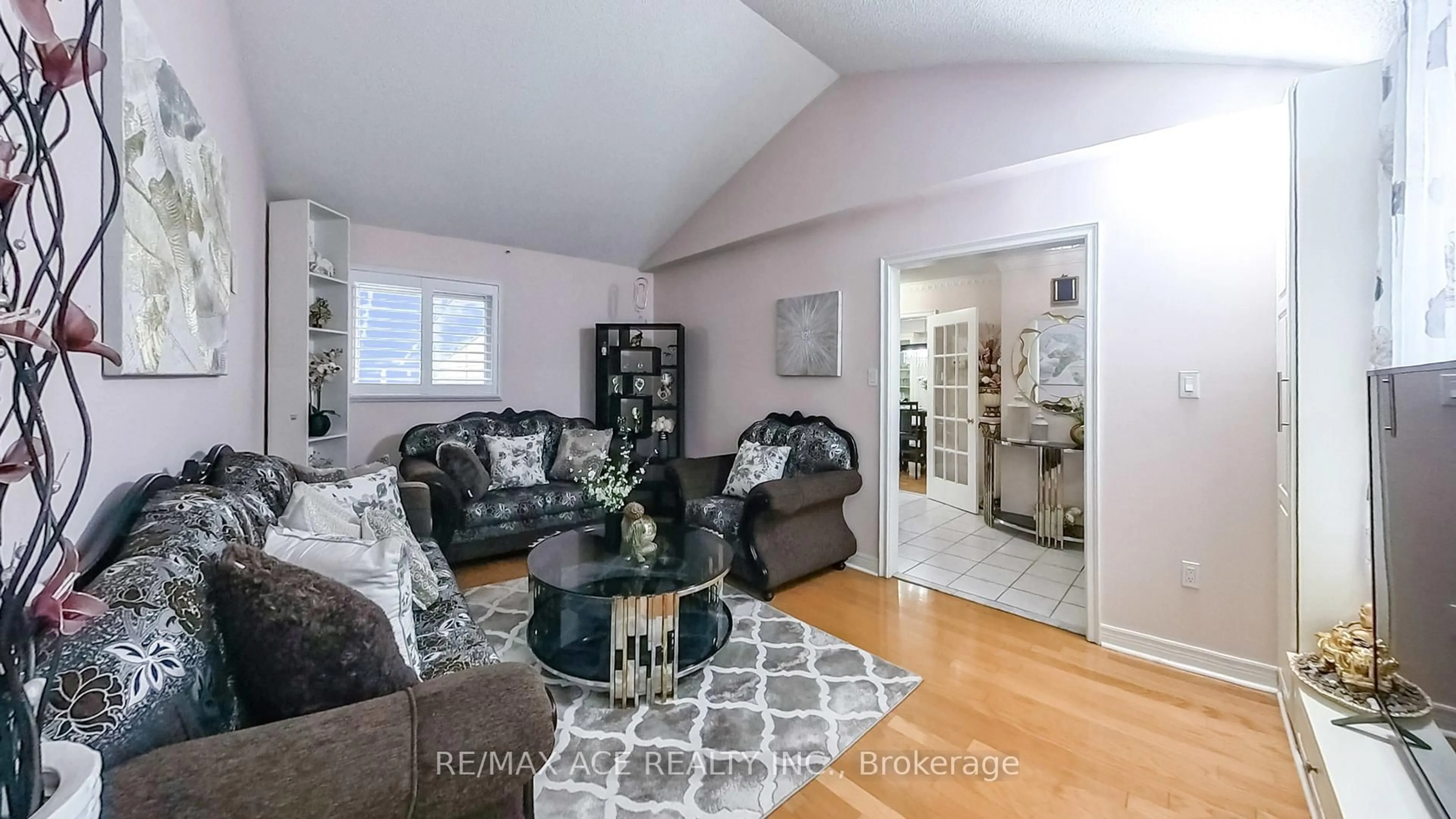 Living room with furniture, wood/laminate floor for 15 Brennan Rd, Ajax Ontario L1T 2G1