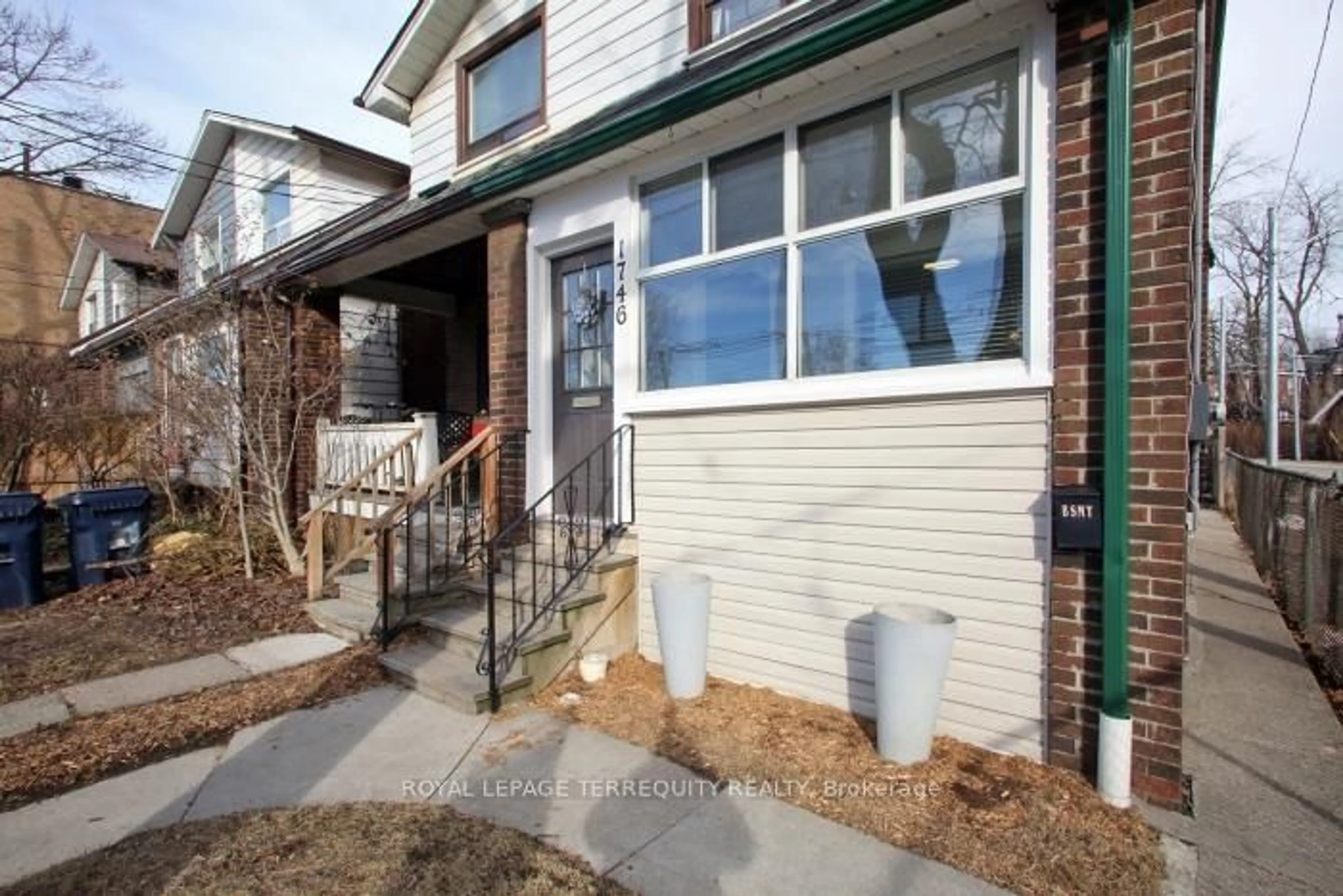 Home with brick exterior material, street for 1746 Queen St, Toronto Ontario M4L 1G7