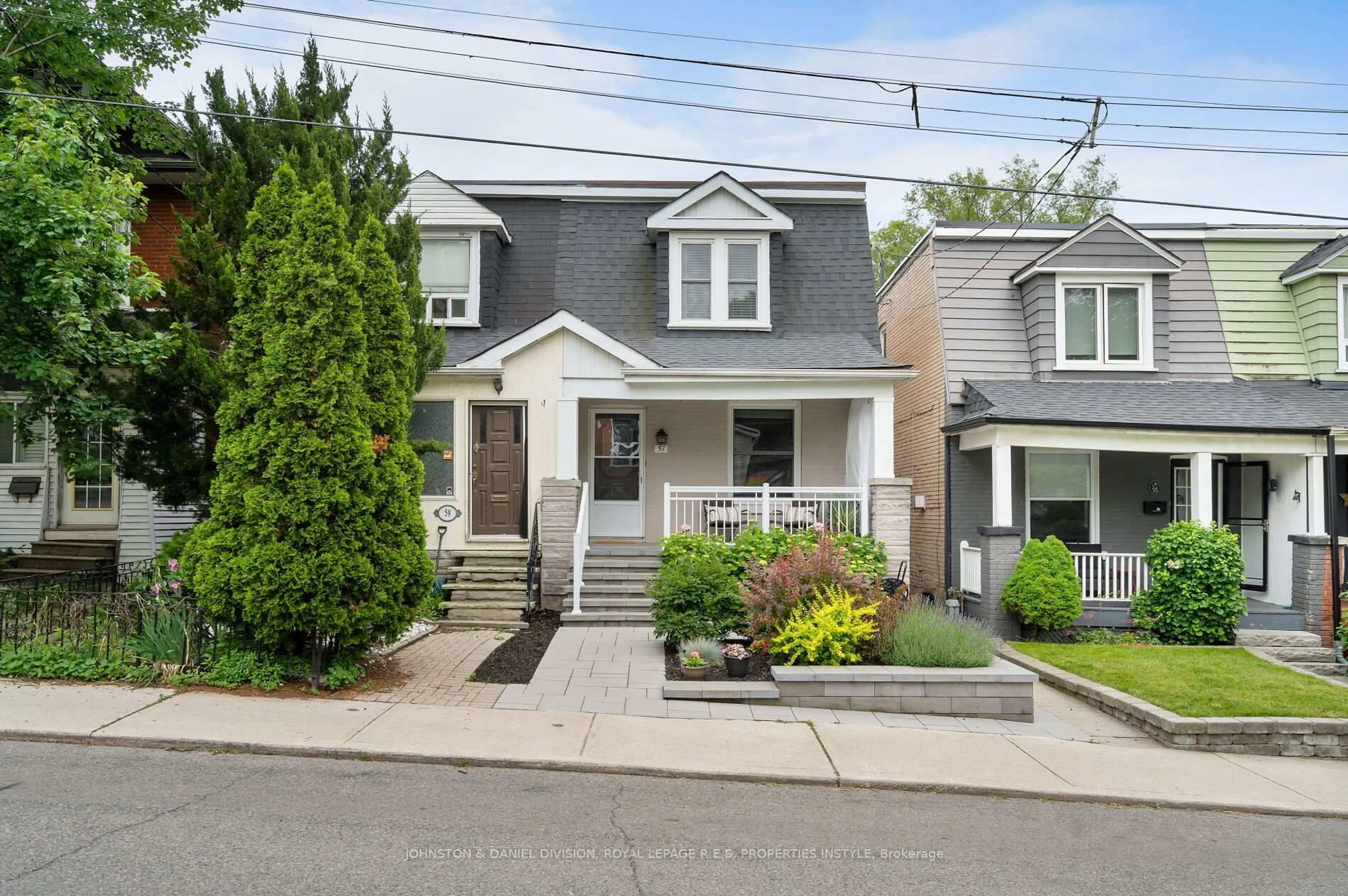 Home with vinyl exterior material, street for 57 Duvernet Ave, Toronto Ontario M4L 2G8