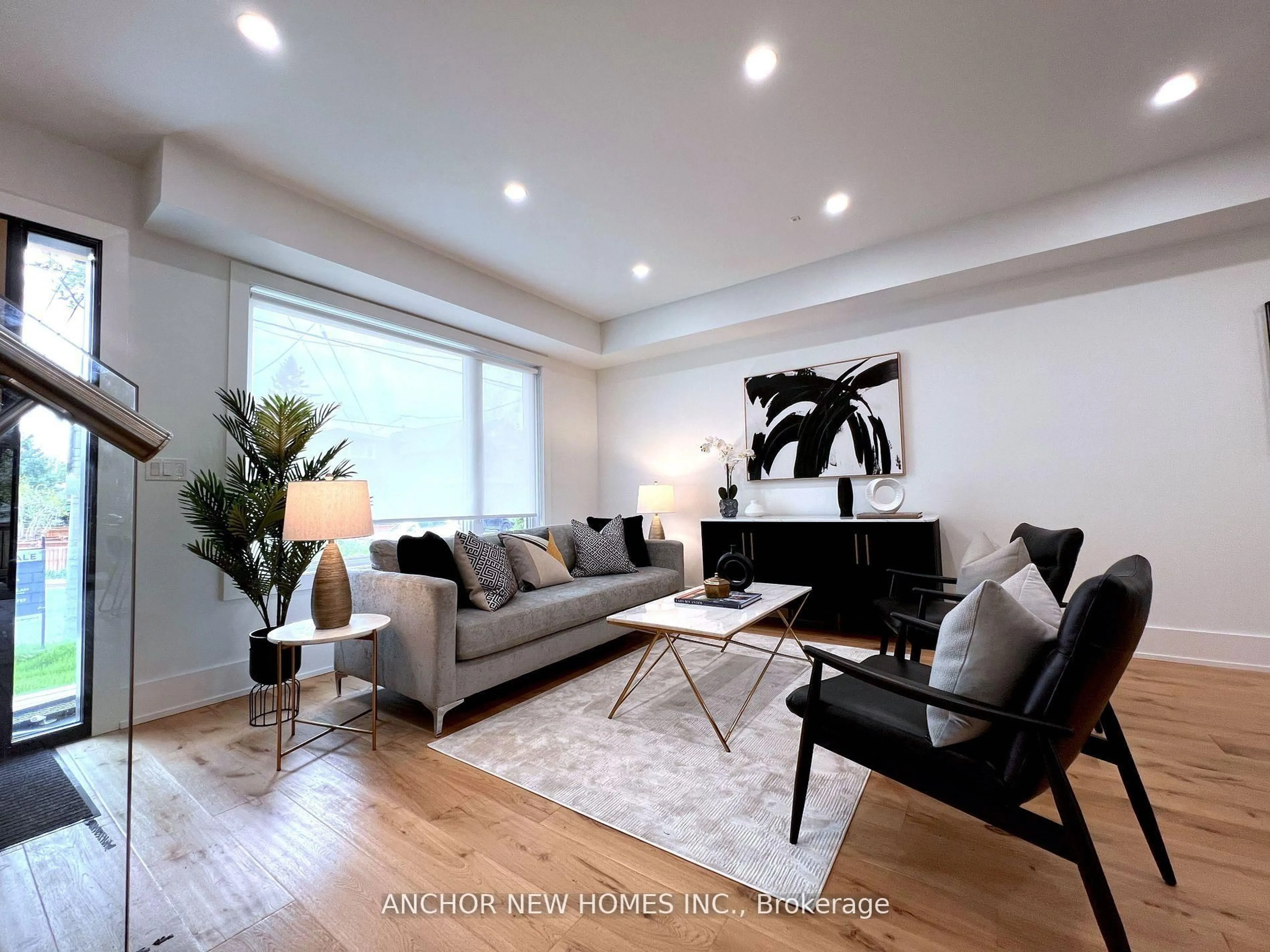 Living room with furniture, wood/laminate floor for 257 Chisholm Ave, Toronto Ontario M4C 4W5