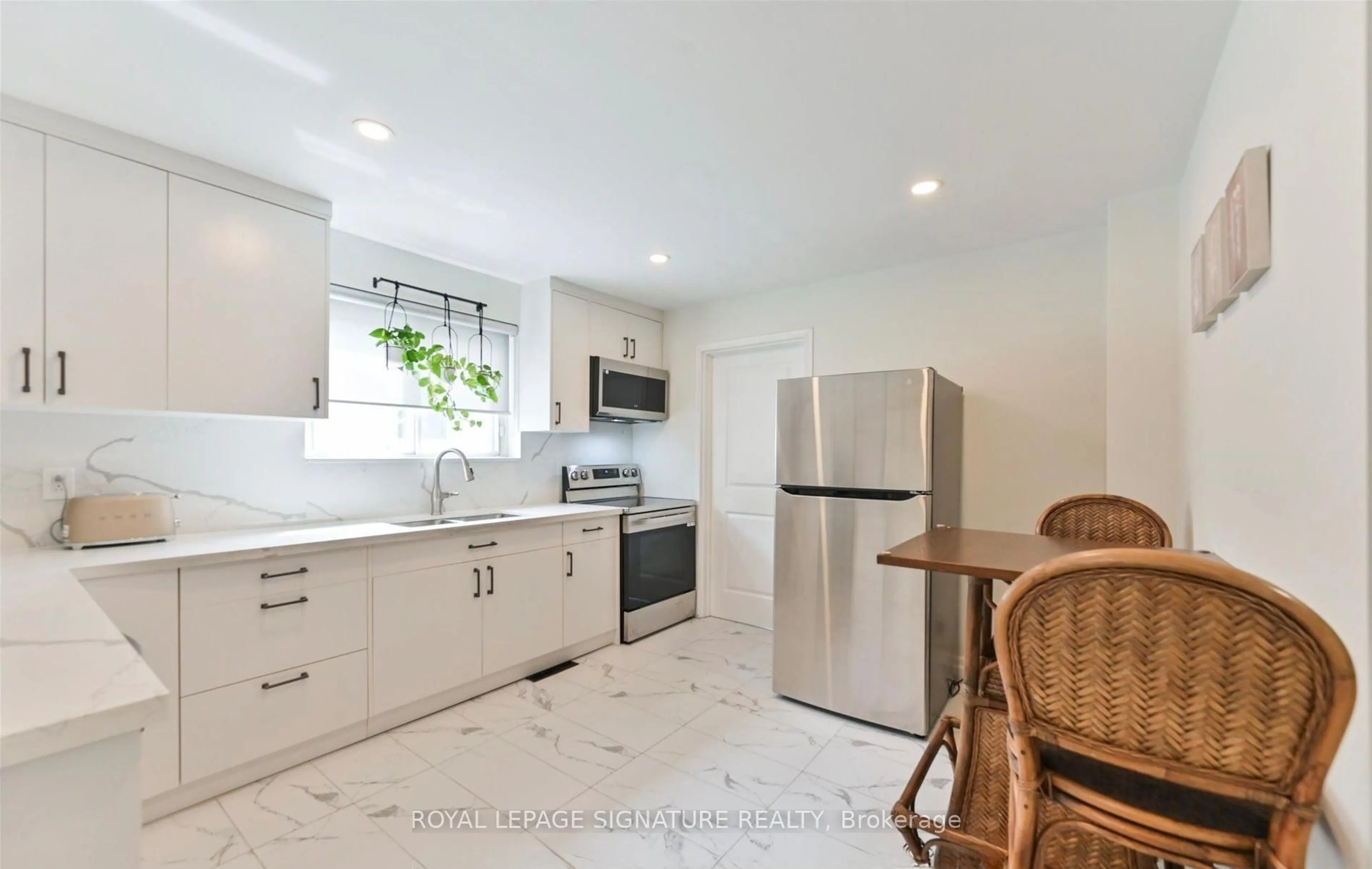 Open concept kitchen, ceramic/tile floor for 94 Meighen Ave, Toronto Ontario M4B 2H7