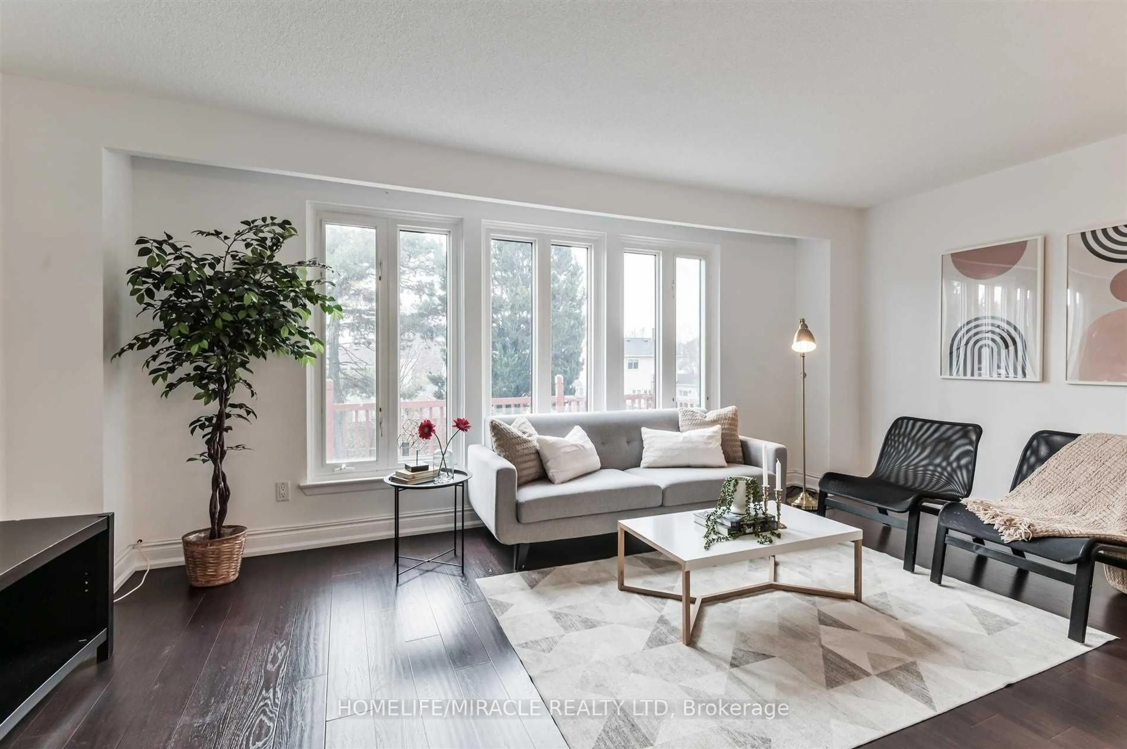 Living room with furniture, wood/laminate floor for 37 Banner Cres, Ajax Ontario L1S 3S8