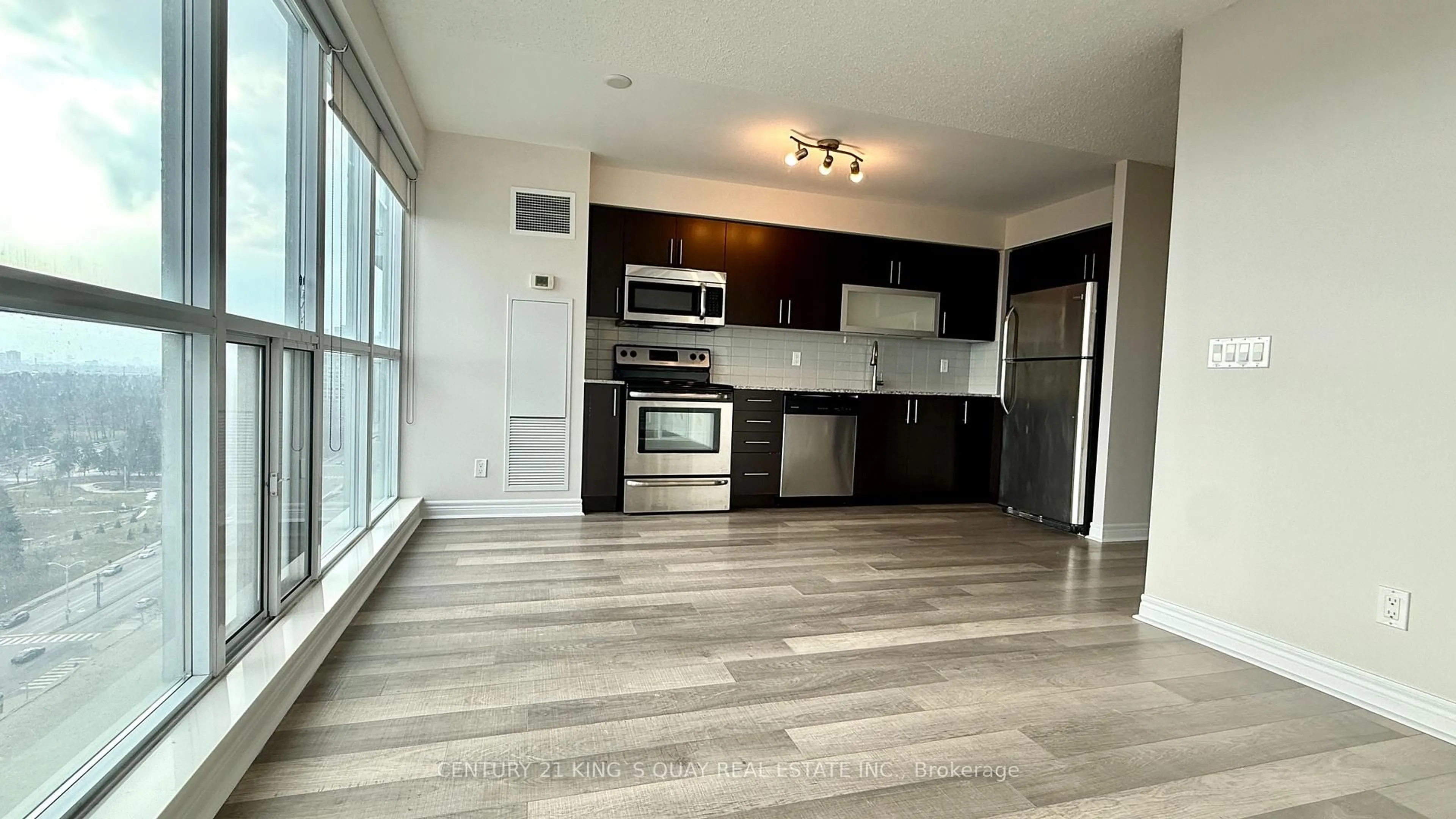 Open concept kitchen, wood/laminate floor for 50 Town Centre Crt #1610, Toronto Ontario M1P 0A9