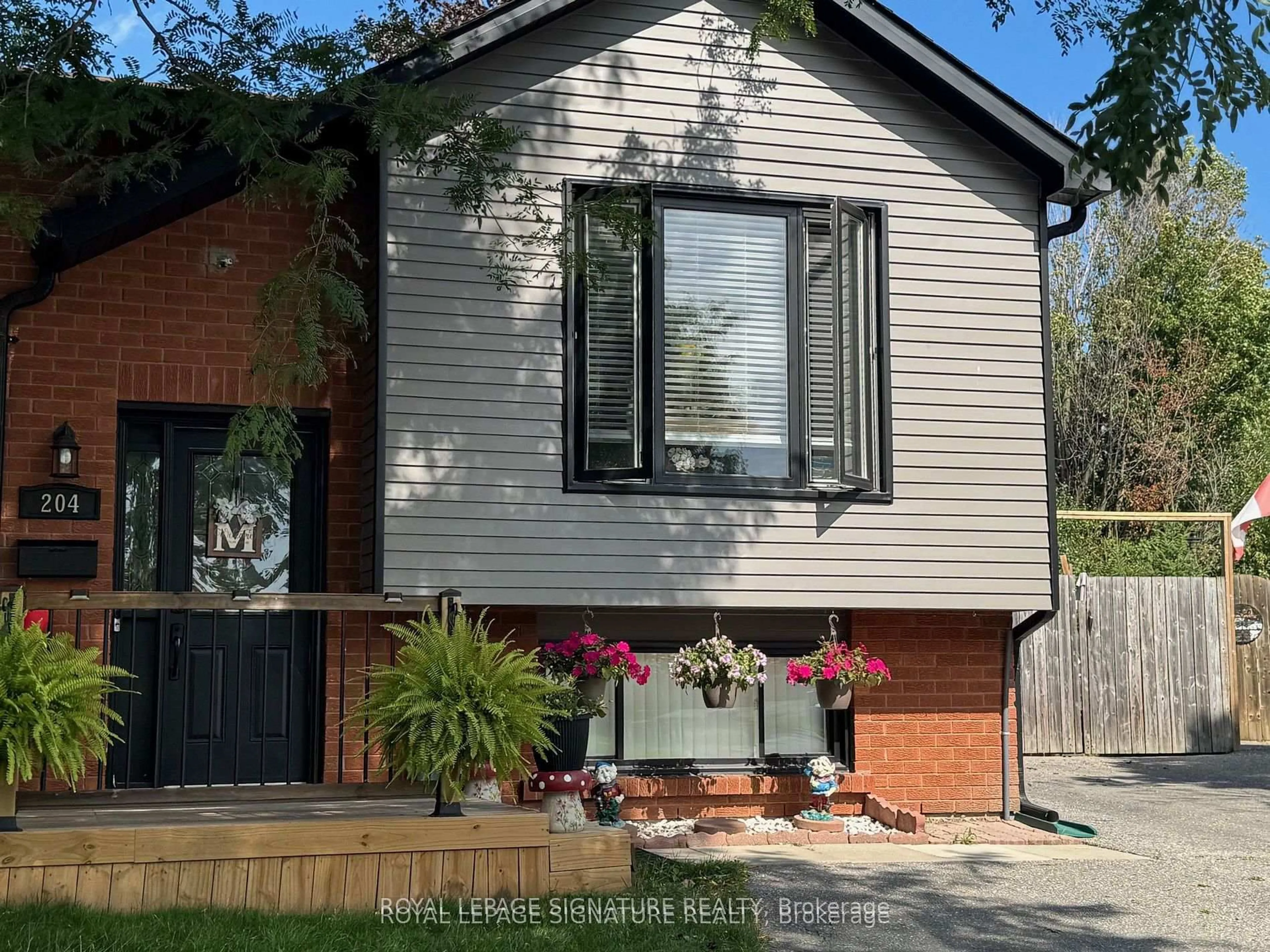 Home with brick exterior material, street for 204 Medina Crt, Oshawa Ontario L1J 7E1
