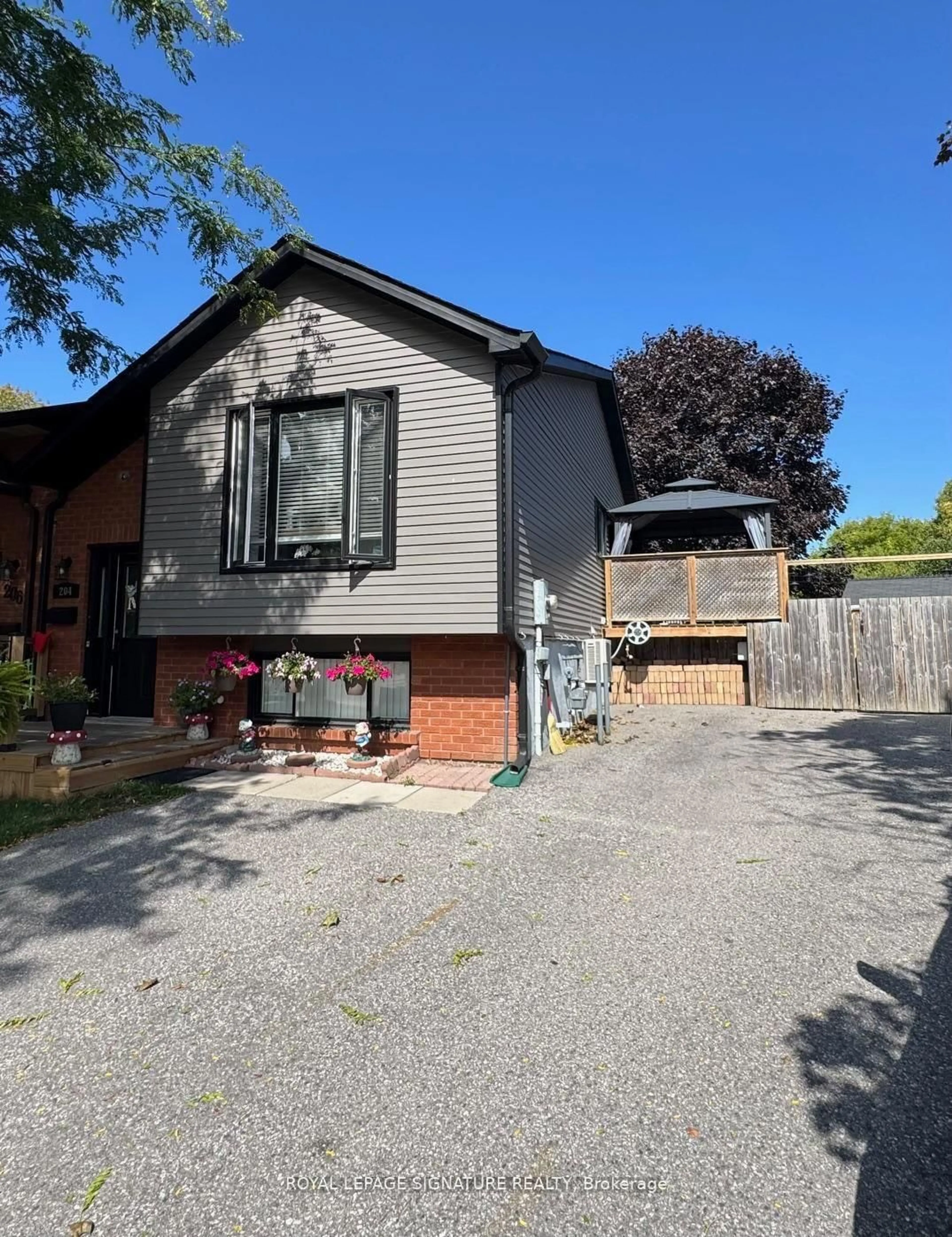 Home with brick exterior material, street for 204 Medina Crt, Oshawa Ontario L1J 7E1