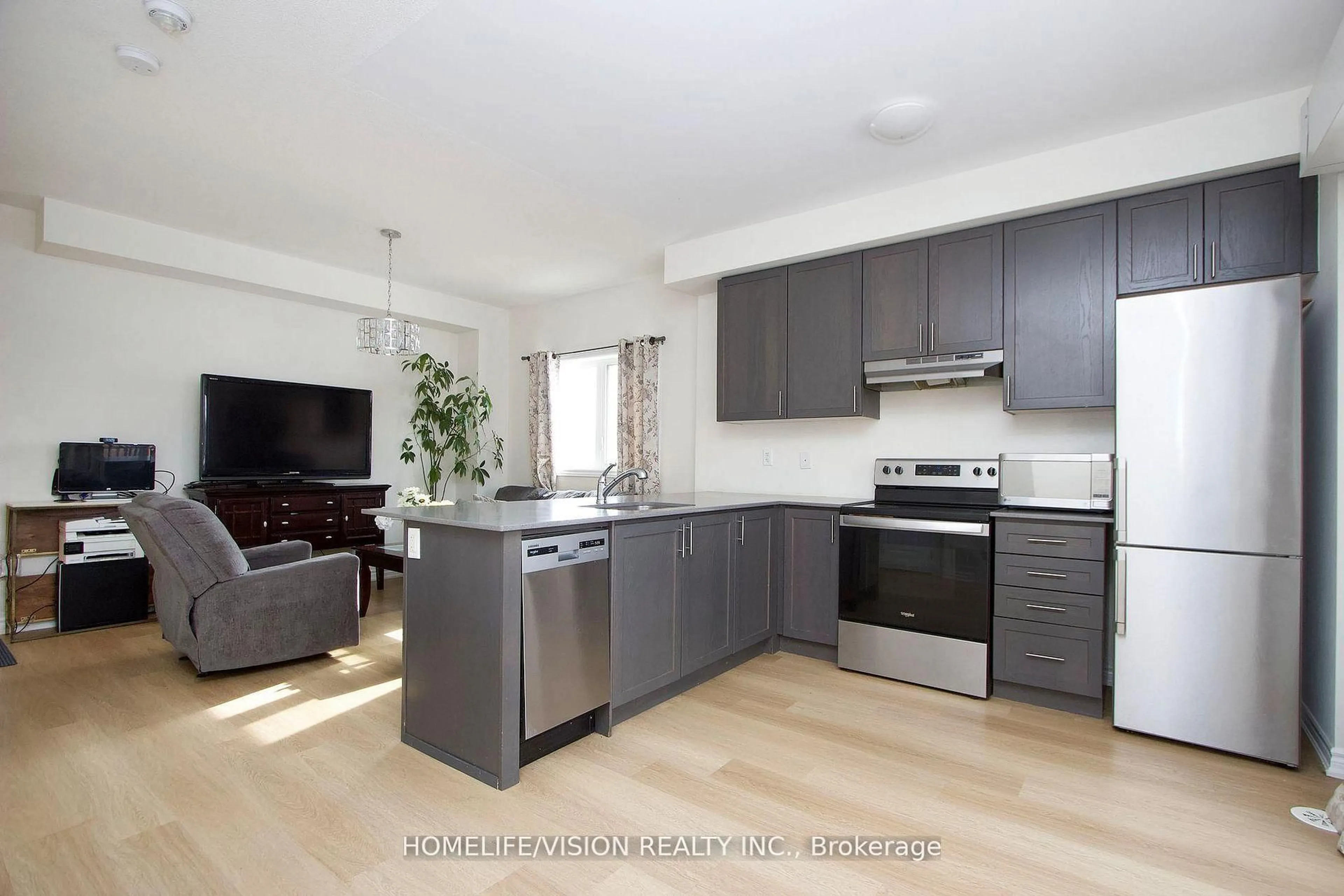 Open concept kitchen, wood/laminate floor for 490 Beresford Path #12, Oshawa Ontario L1H 0B2