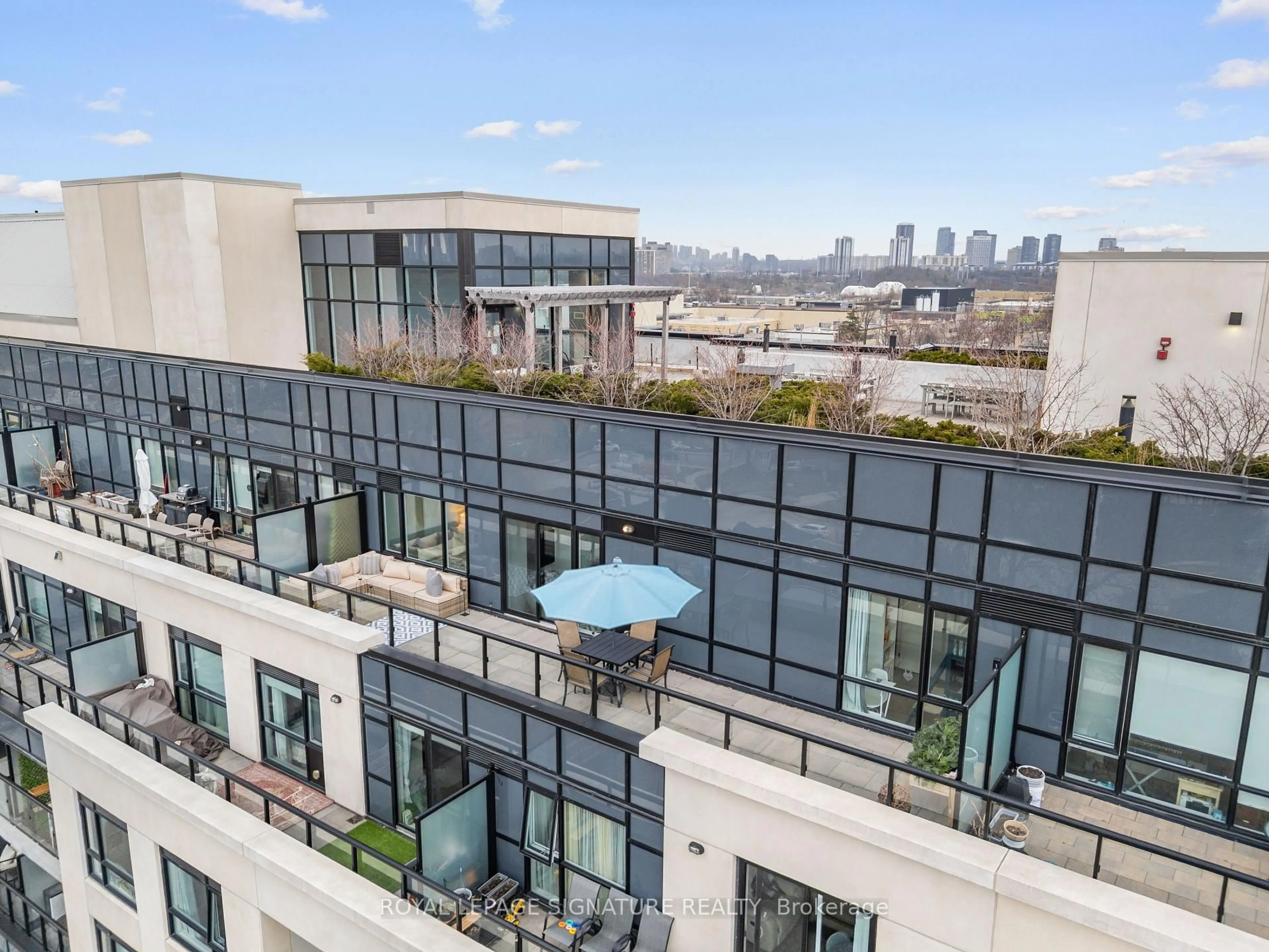 Patio, city buildings view from balcony for 1401 O'Connor Dr #715, Toronto Ontario M4B 2V5