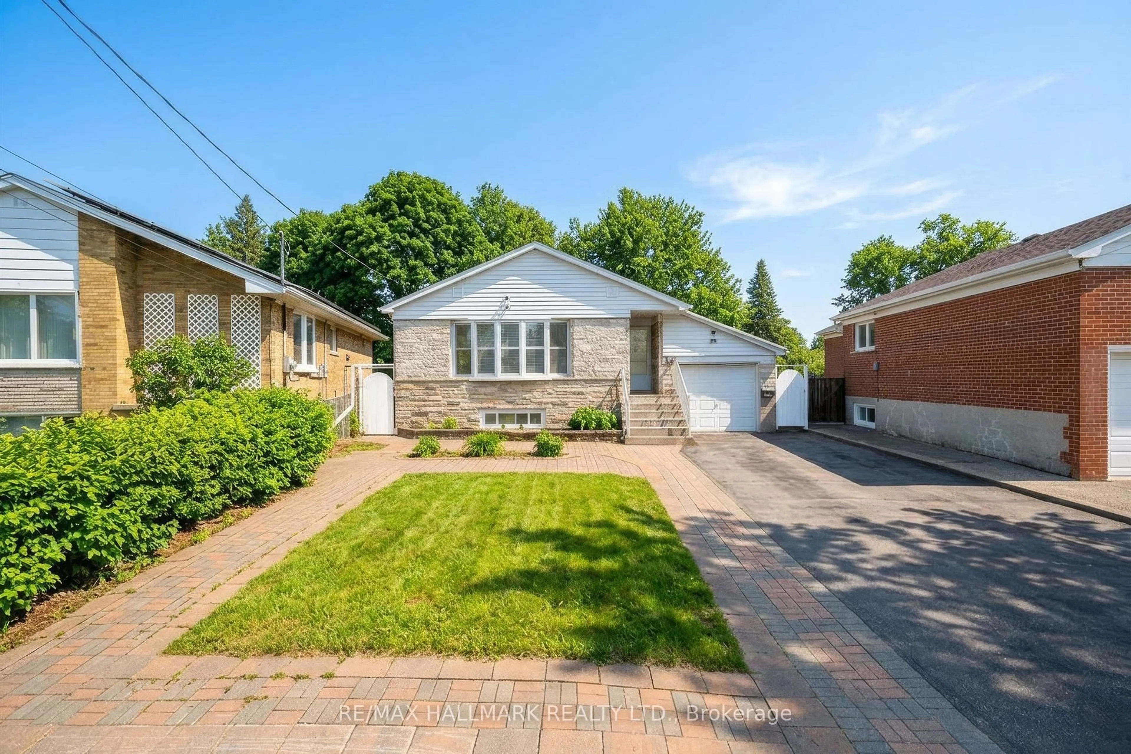 Home with brick exterior material, street for 65 Montvale Dr, Toronto Ontario M1M 3E5