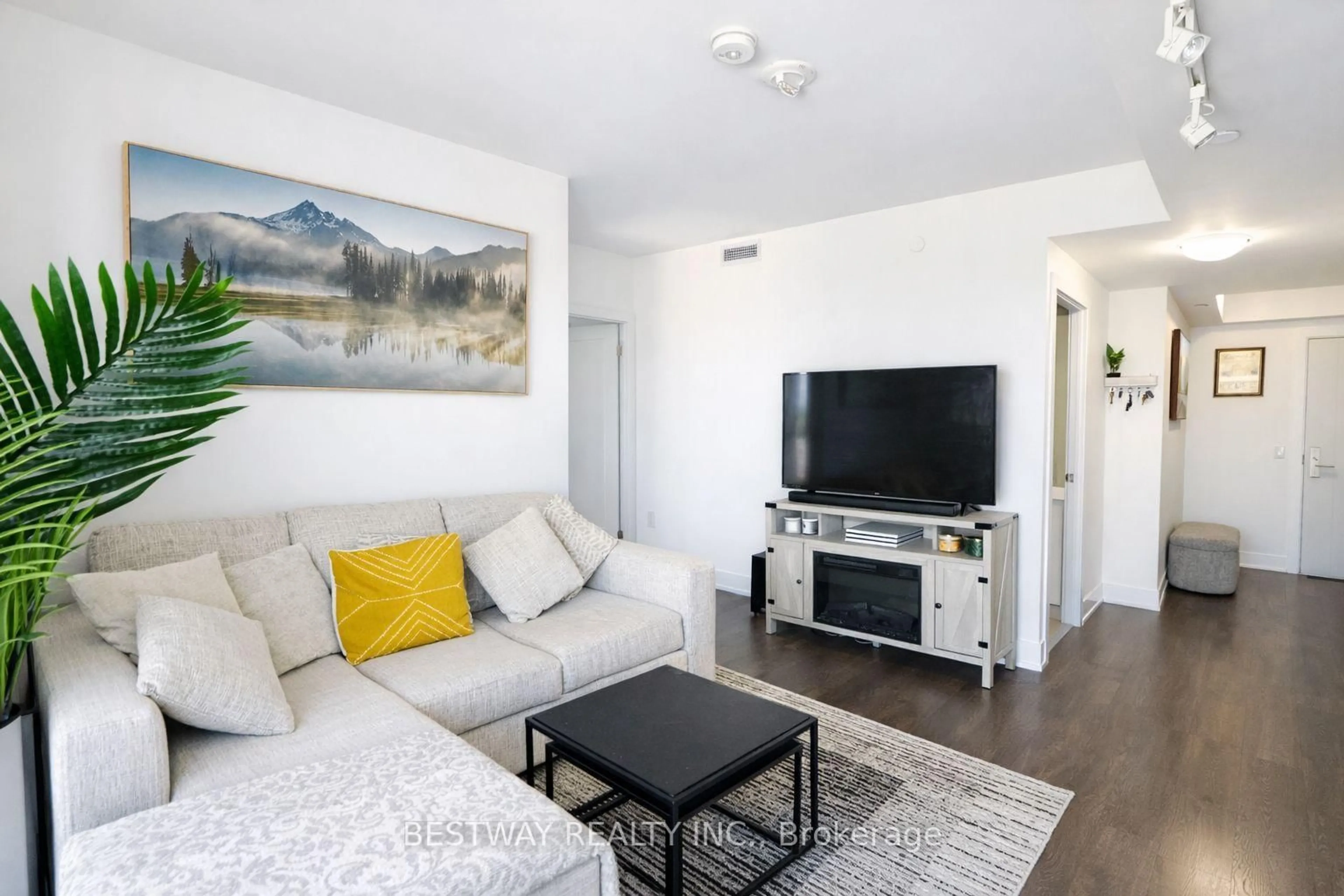 Living room with furniture, wood/laminate floor for 2550 Simcoe St #607, Oshawa Ontario L1L 0R5