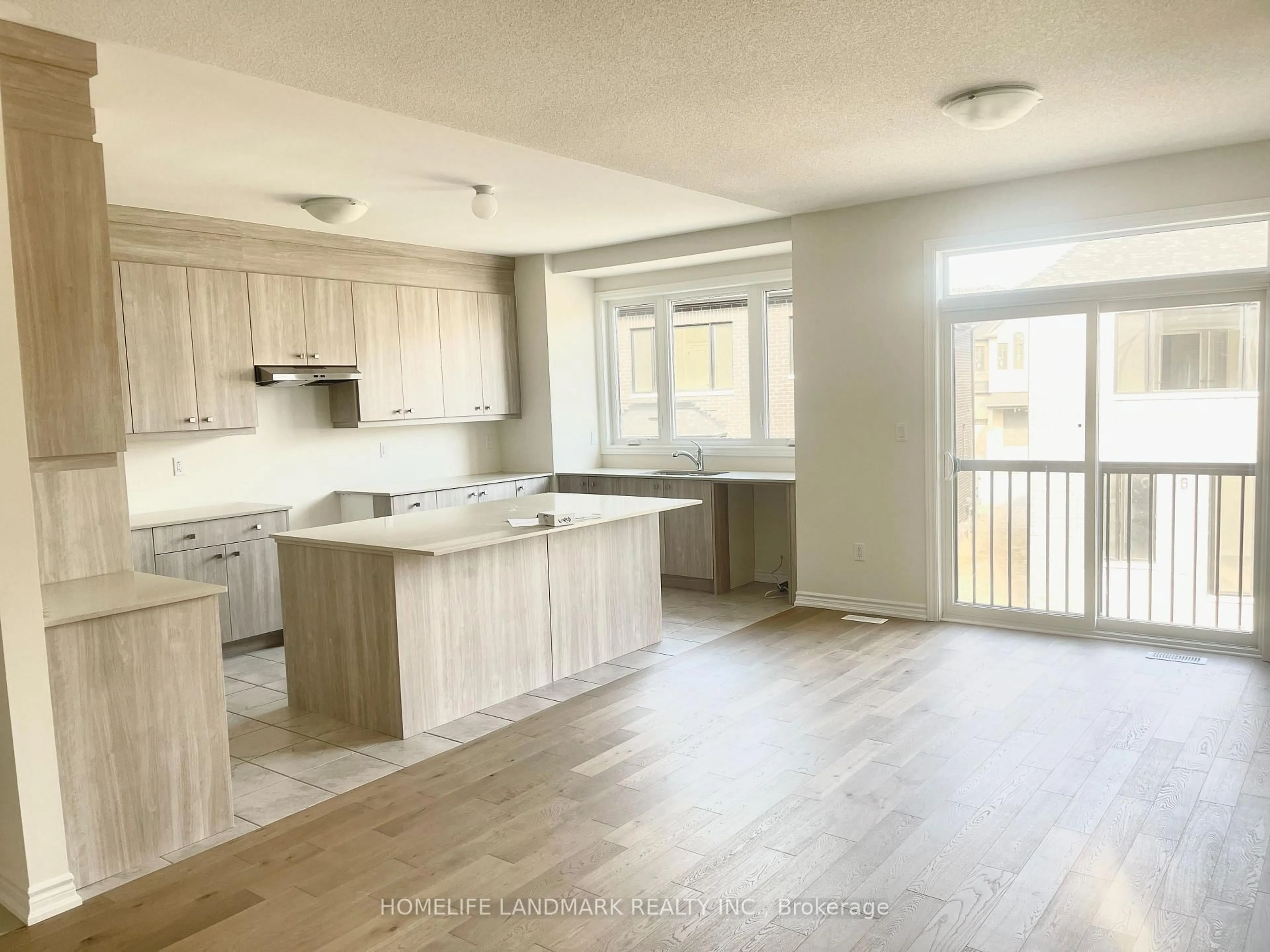 Open concept kitchen, wood/laminate floor for 1017 PISCES Tr, Pickering Ontario L1X 0P7