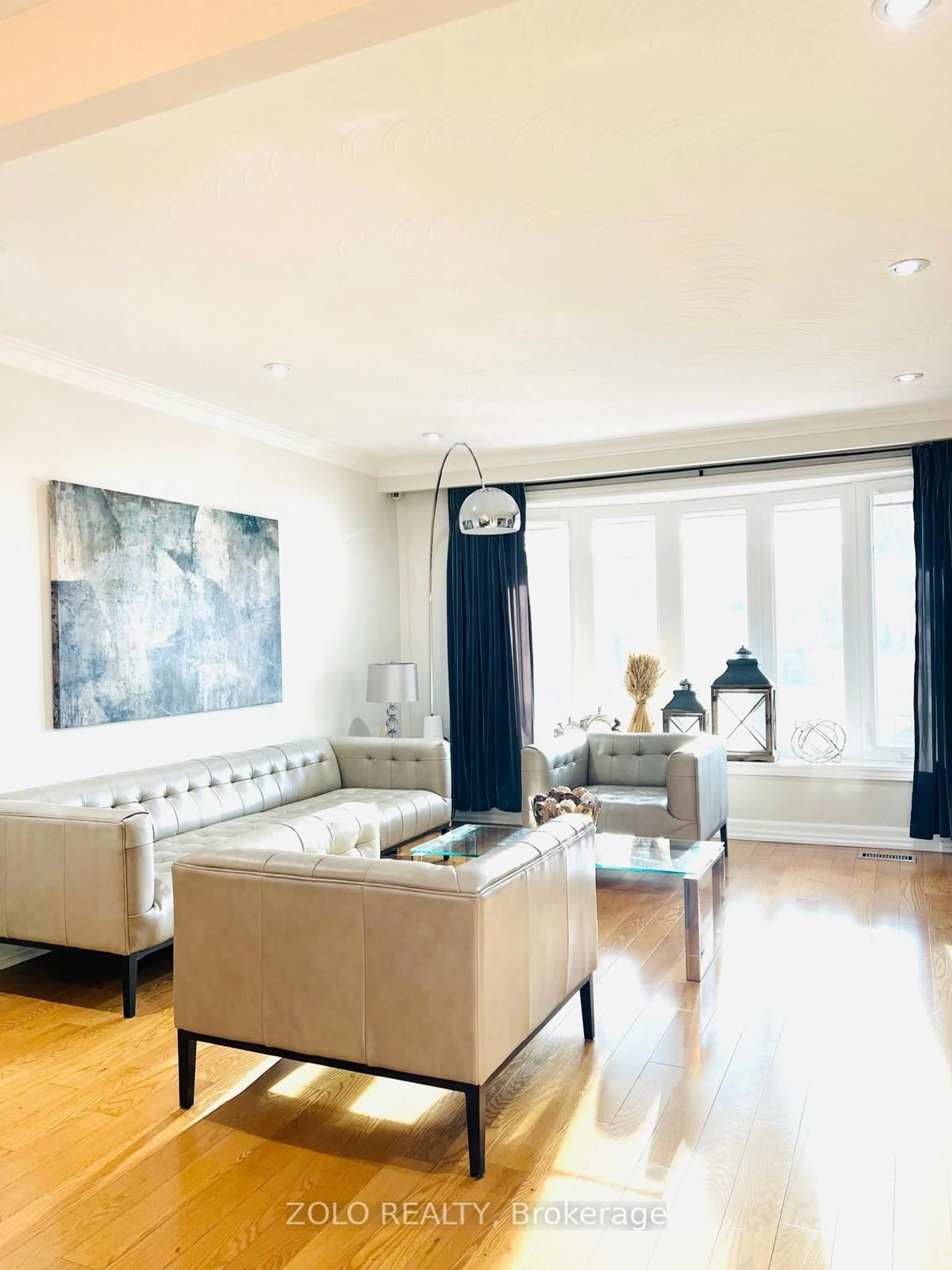 Living room with furniture, wood/laminate floor for 48 Arkona Dr, Toronto Ontario M1T 1X3