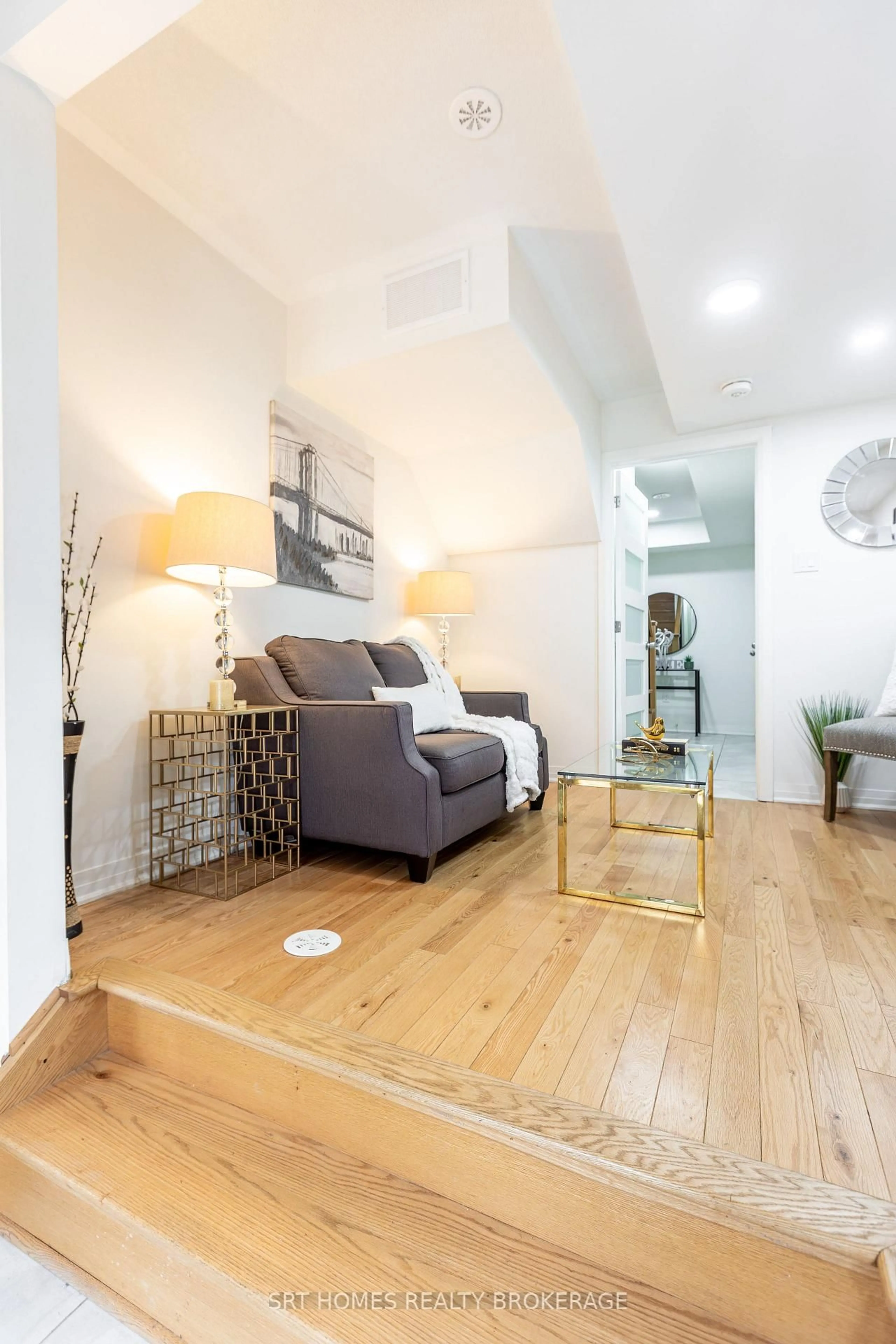 Living room with furniture, wood/laminate floor for 224 Lord Elgin Lane, Clarington Ontario L1C 7E8