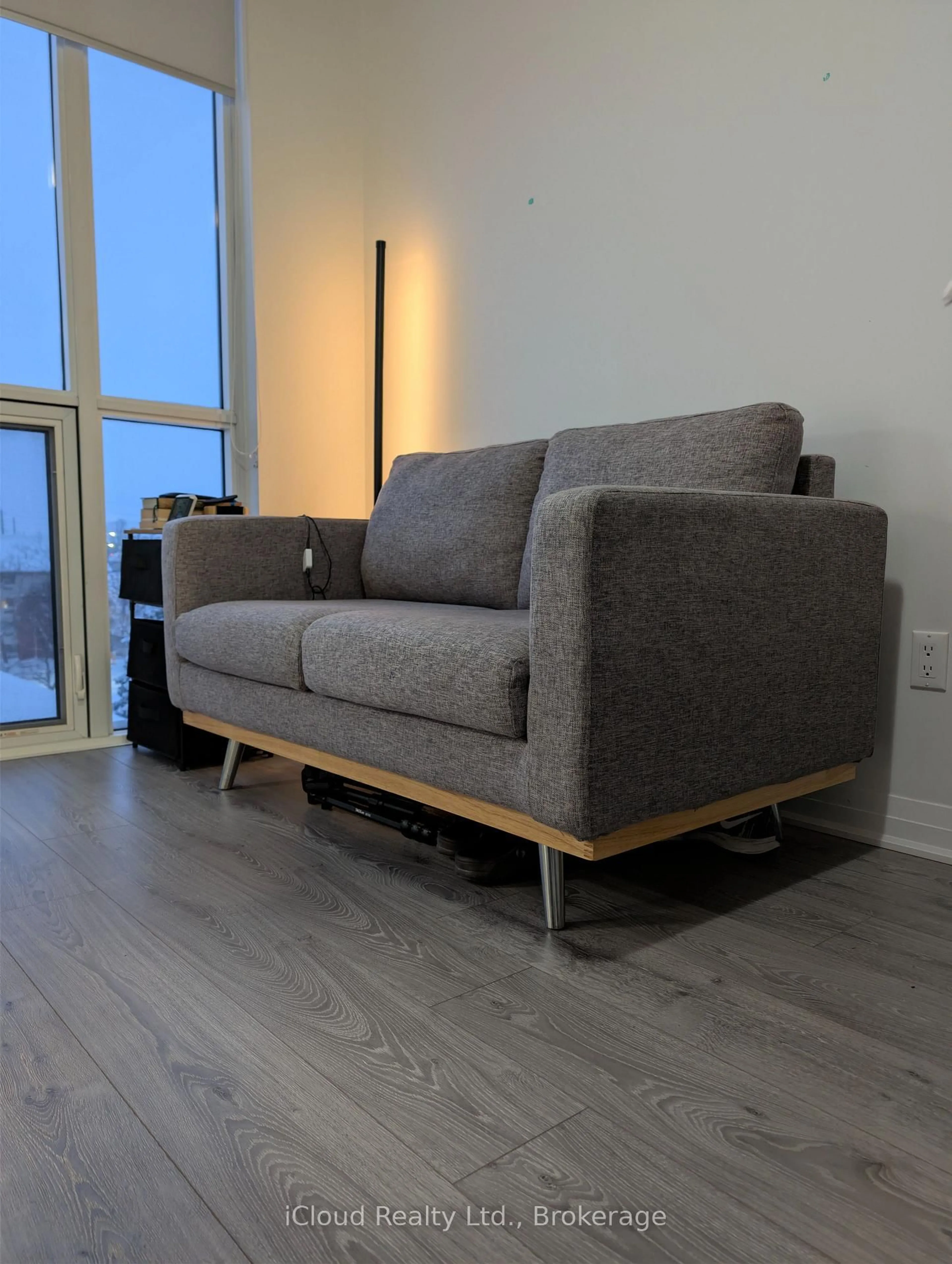 Living room with furniture, wood/laminate floor for 1900 Simcoe St #518, Oshawa Ontario L1G 4Y3
