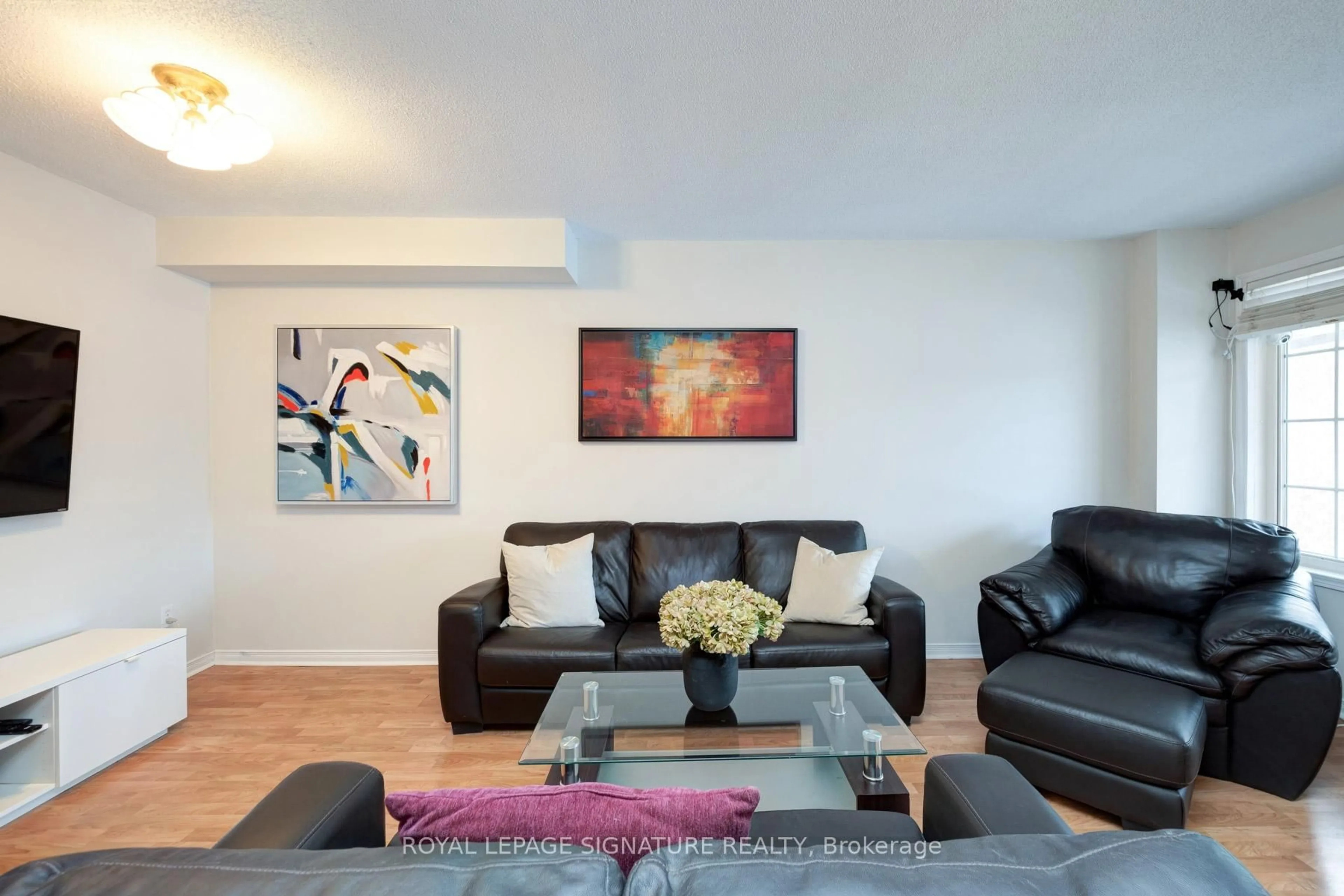 Living room with furniture, wood/laminate floor for 1683 Canadore Cres, Oshawa Ontario L1G 8A7