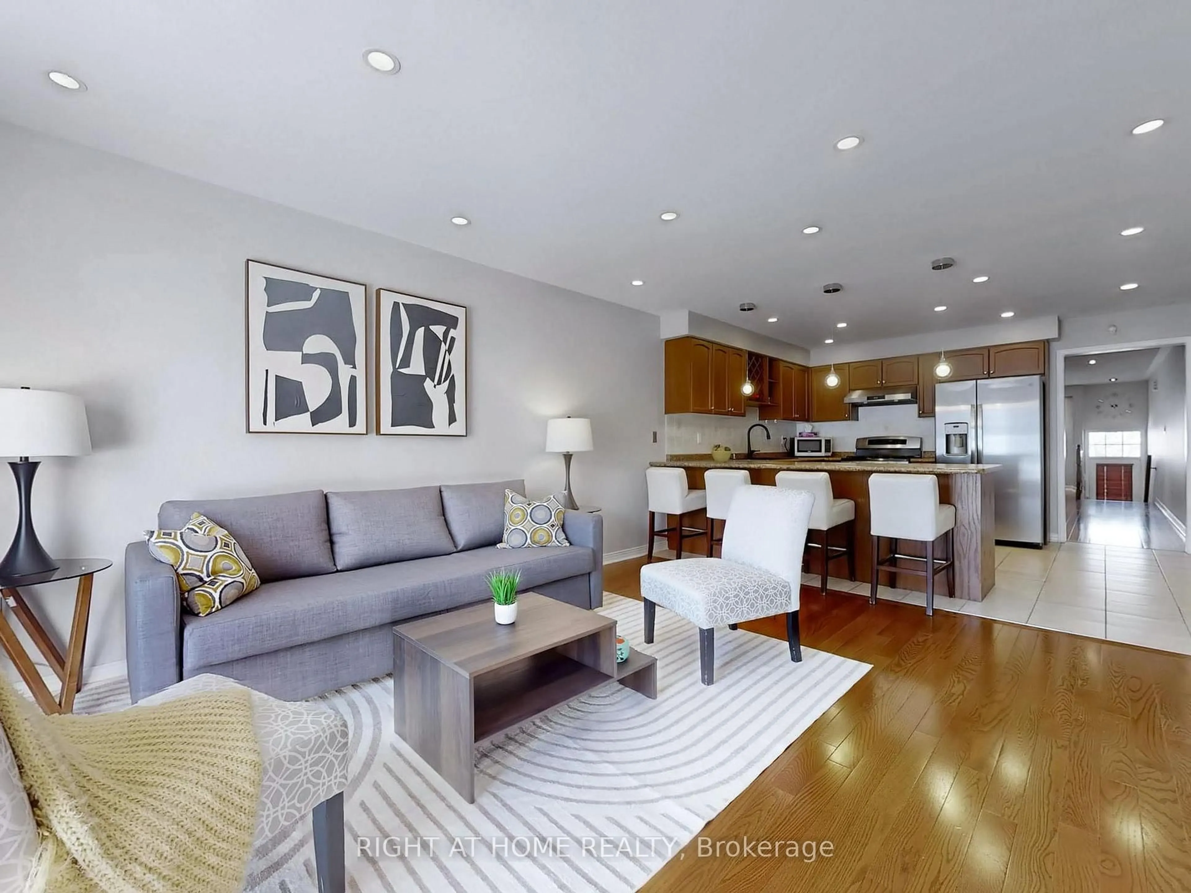 Living room with furniture, wood/laminate floor for 49 Wilkes Cres, Toronto Ontario M1L 0B4